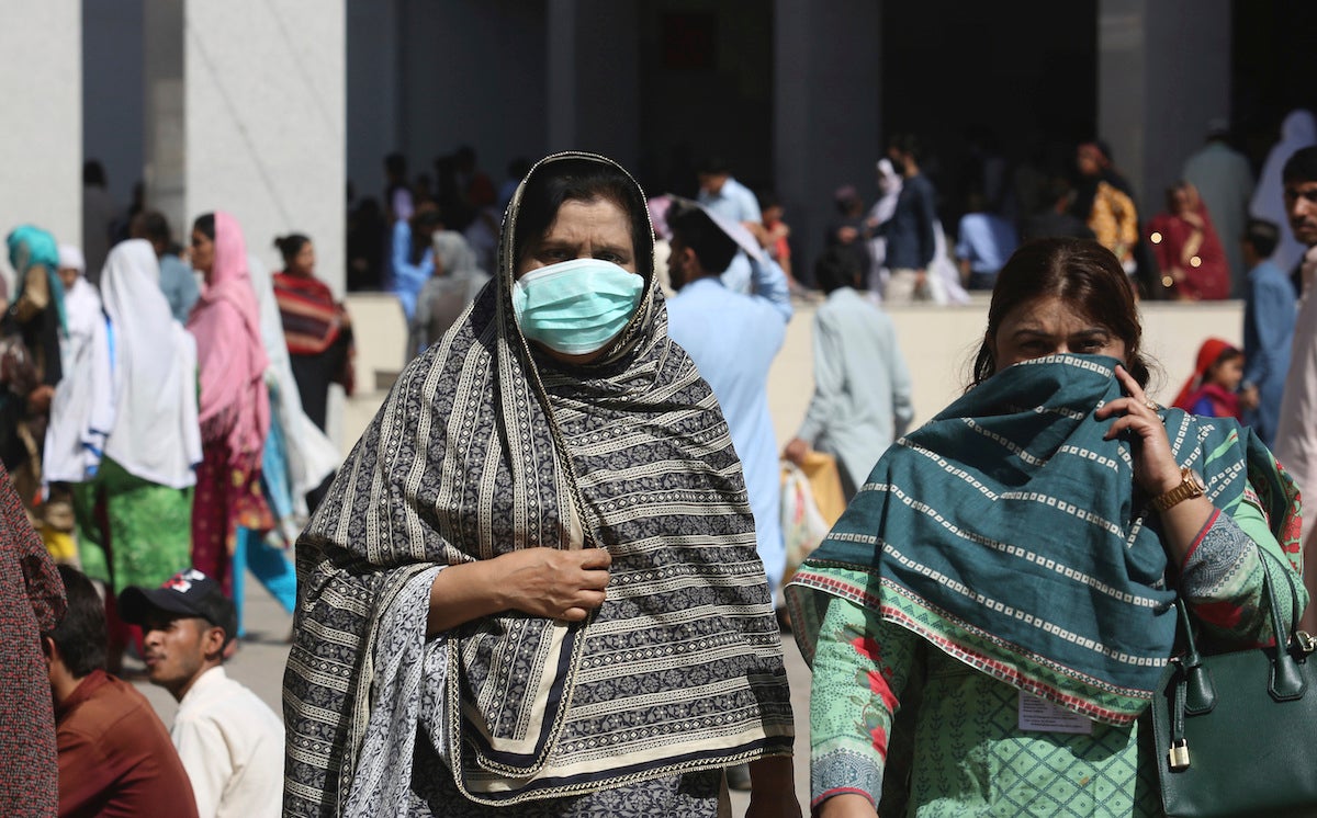 Pakistani women wearing face masks leave the Aga Khan hospital where a patient suspected of having contracted coronavirus was admitted, in Karachi, Pakistan, Thursday, Feb. 27, 2020. 