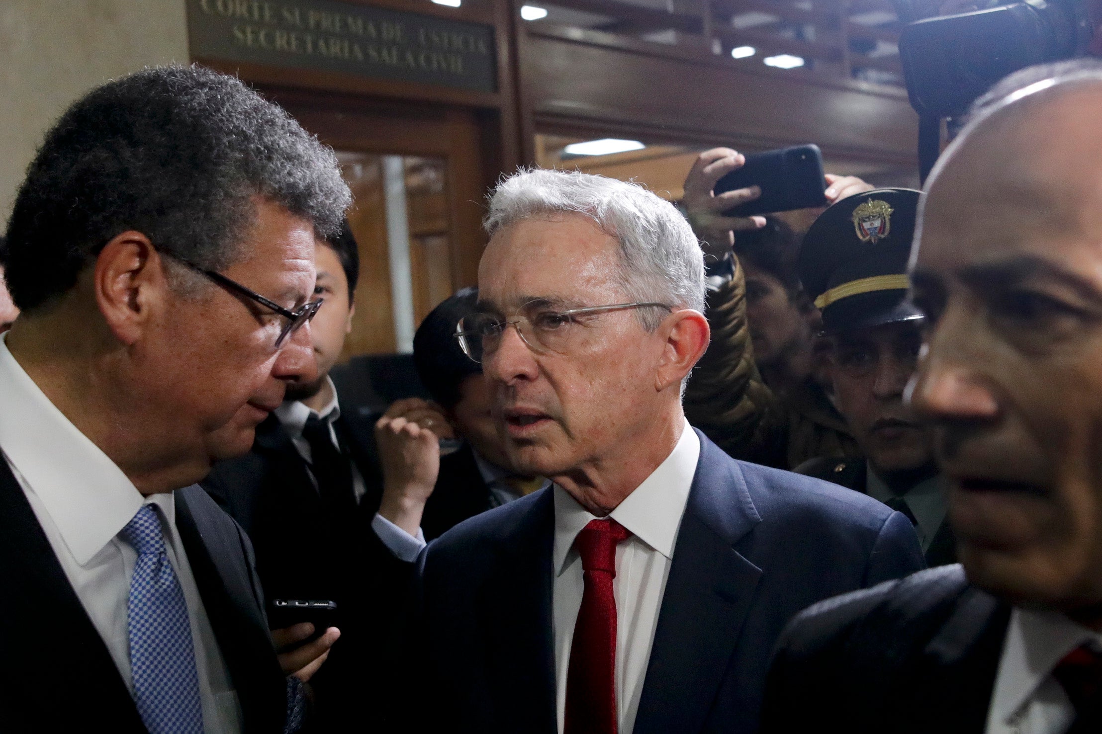 Former Colombian president Álvaro Uribe arrives at the Supreme Court for questioning in a case about his alleged involvement in witness tampering in Bogotá, Colombia, Tuesday, October 8, 2019.
