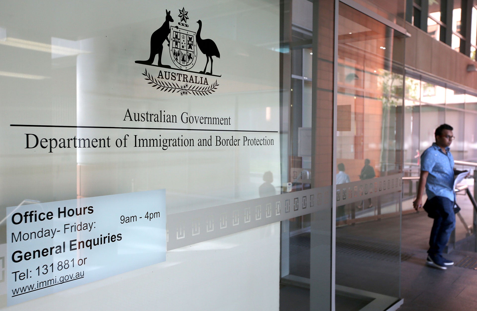 A man leaves the Department of Immigration and Border Protection offices in Sydney, Thursday, April 20, 2017.  