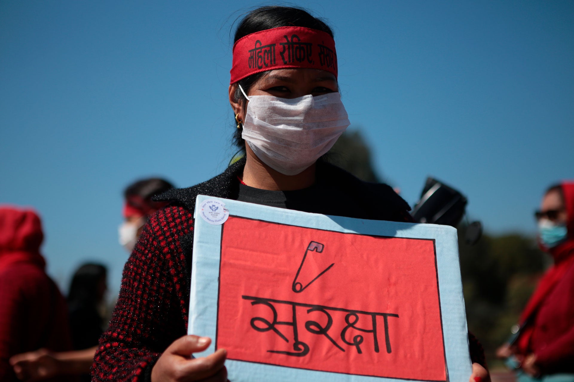 A woman holds a placard during a demonstration on International Women's Day to protest against inequality and sexual violence, March 8, 2020.