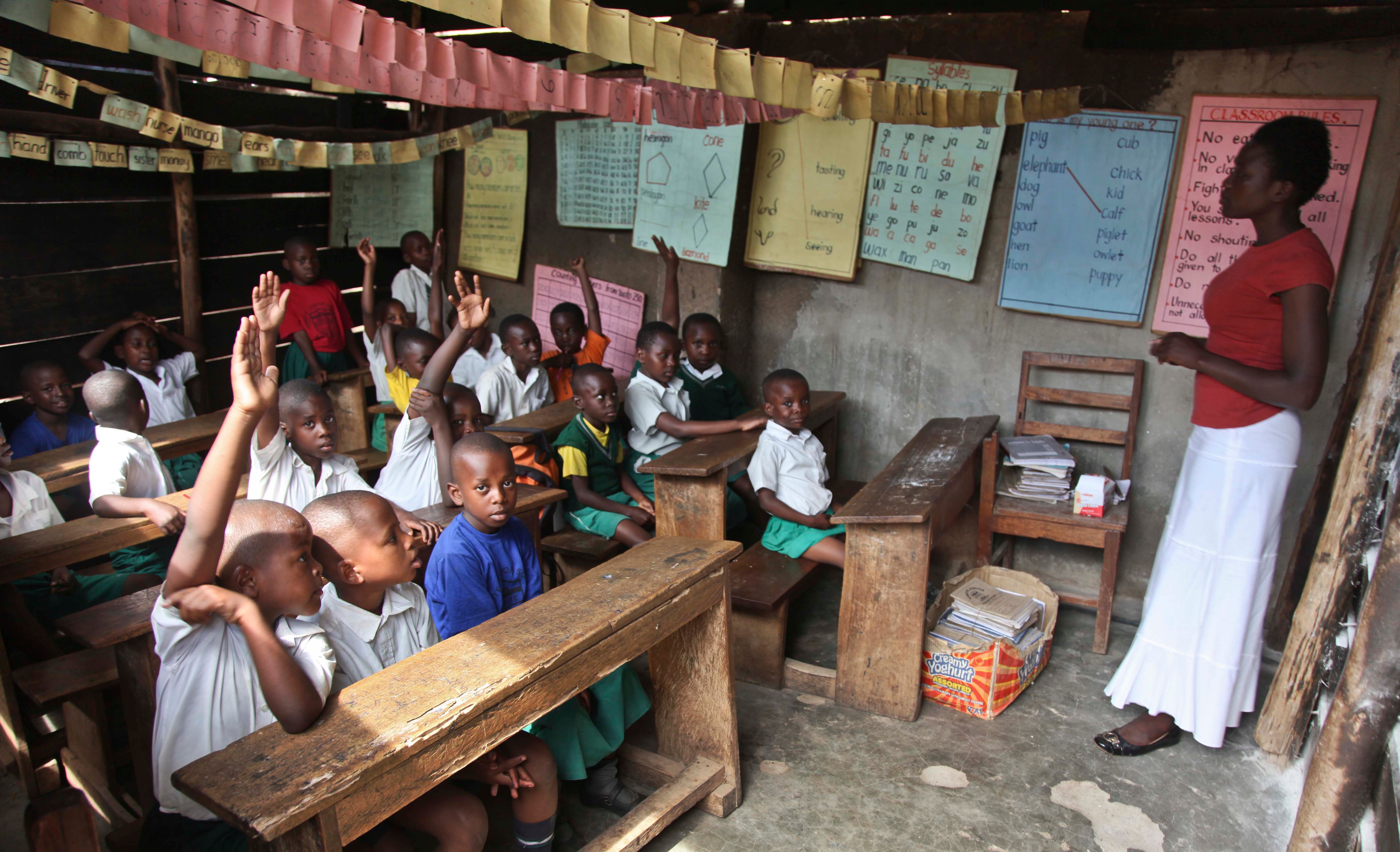 Pupils sit in a classroom at the Kibuye Junior Primary School in the Katwe slum of Kampala, Uganda, October 14, 2016.