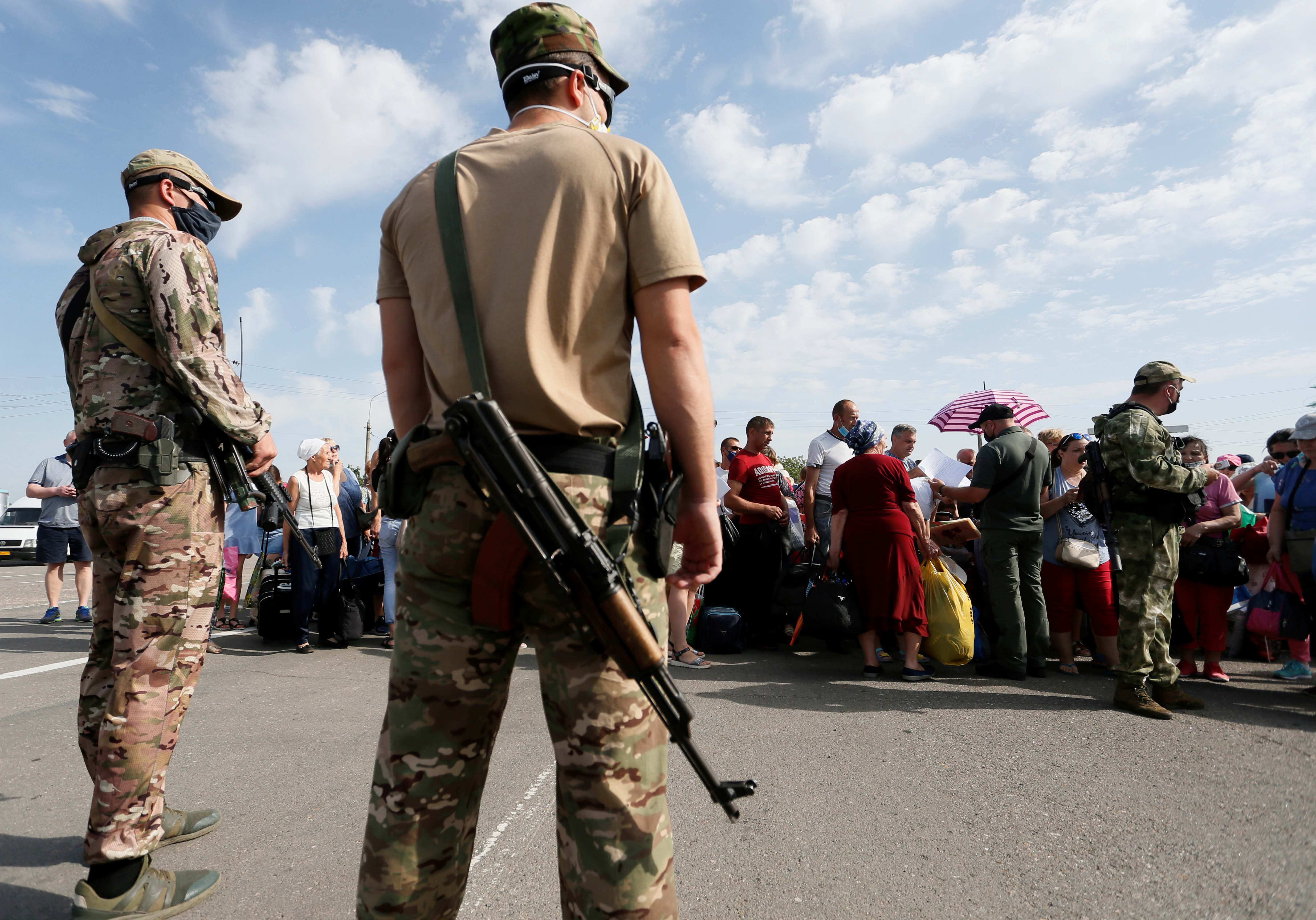 Armed men with the self-proclaimed Donetsk People's Republic stand guard.