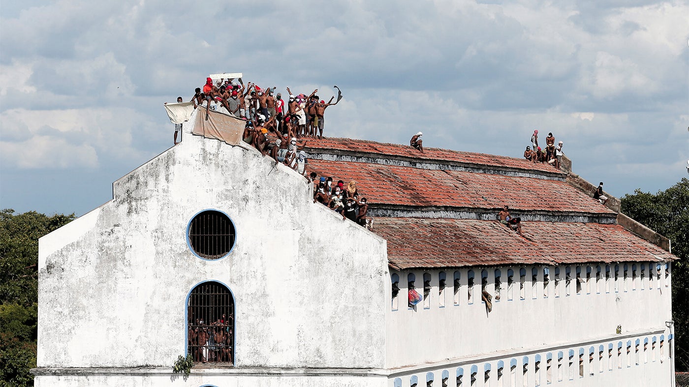 Inmates protest on the roof a prison building calling for speedier judicial processes and increased protection amid rising cases of Covid-19, Colombo, Sri Lanka, November 18, 2020.