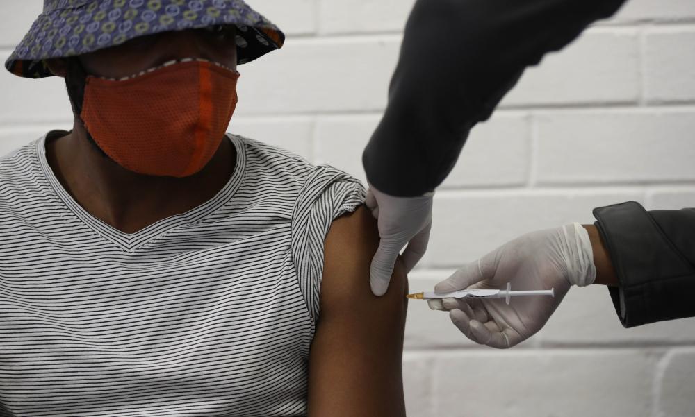 A person in Soweto, South Africa receives an injection as they participate in a clinical trial for a Covid-19 vaccine in June 2020. 