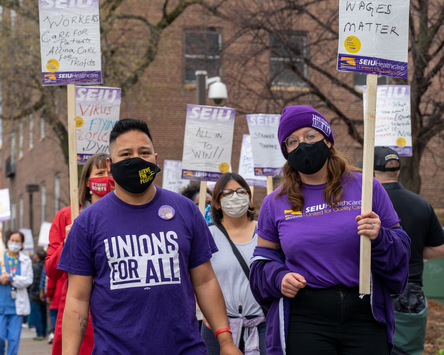 Frontline healthcare workers in Minnesota picket for fair wages. 