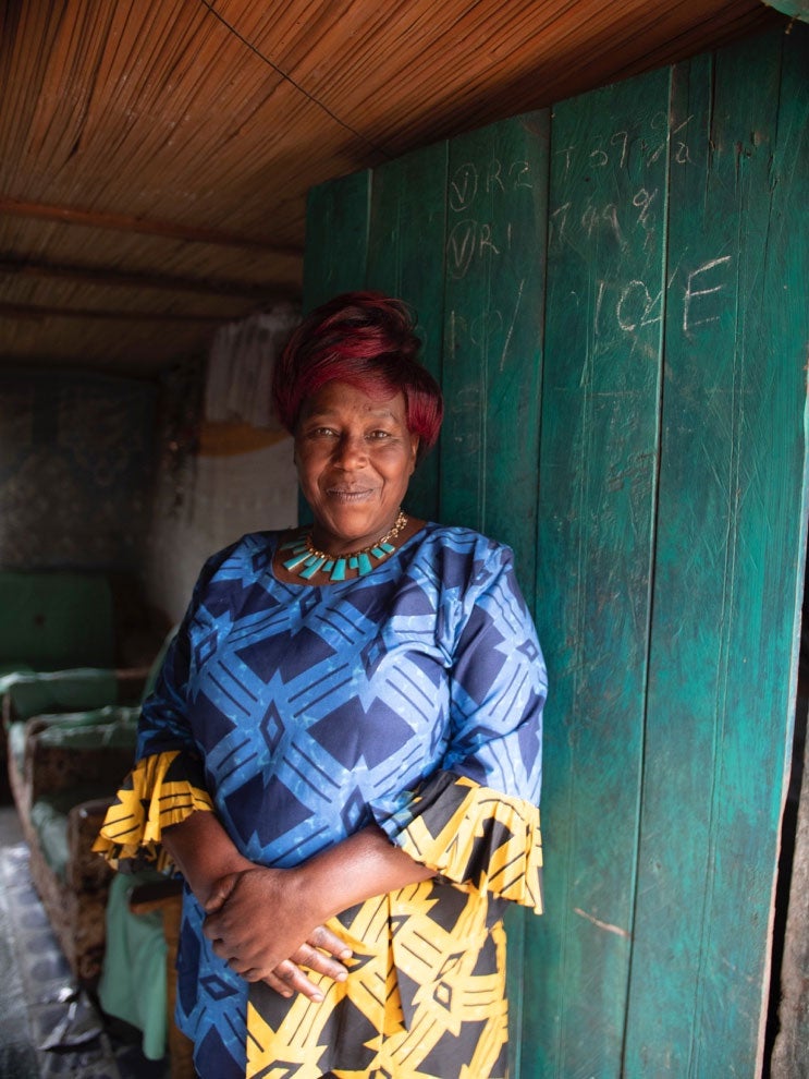 Gladys Koskey stands in her home