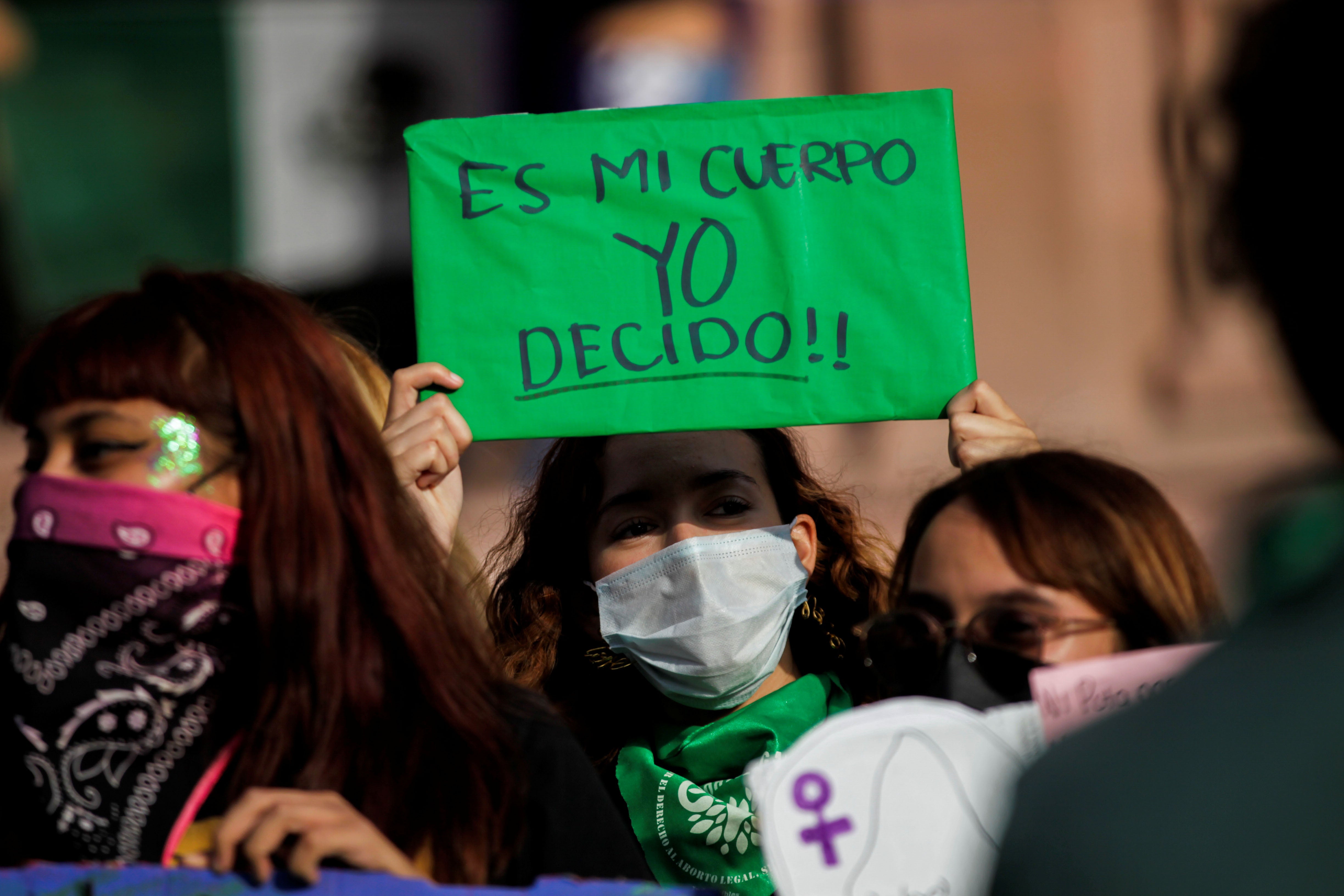 A woman holds up a banner that reads "My body, I decide" during a rally to celebrate the decision of the Mexican Supreme Court that found the total criminalization of abortion to be unconstitutional, in Saltillo, Mexico September 7, 2021.