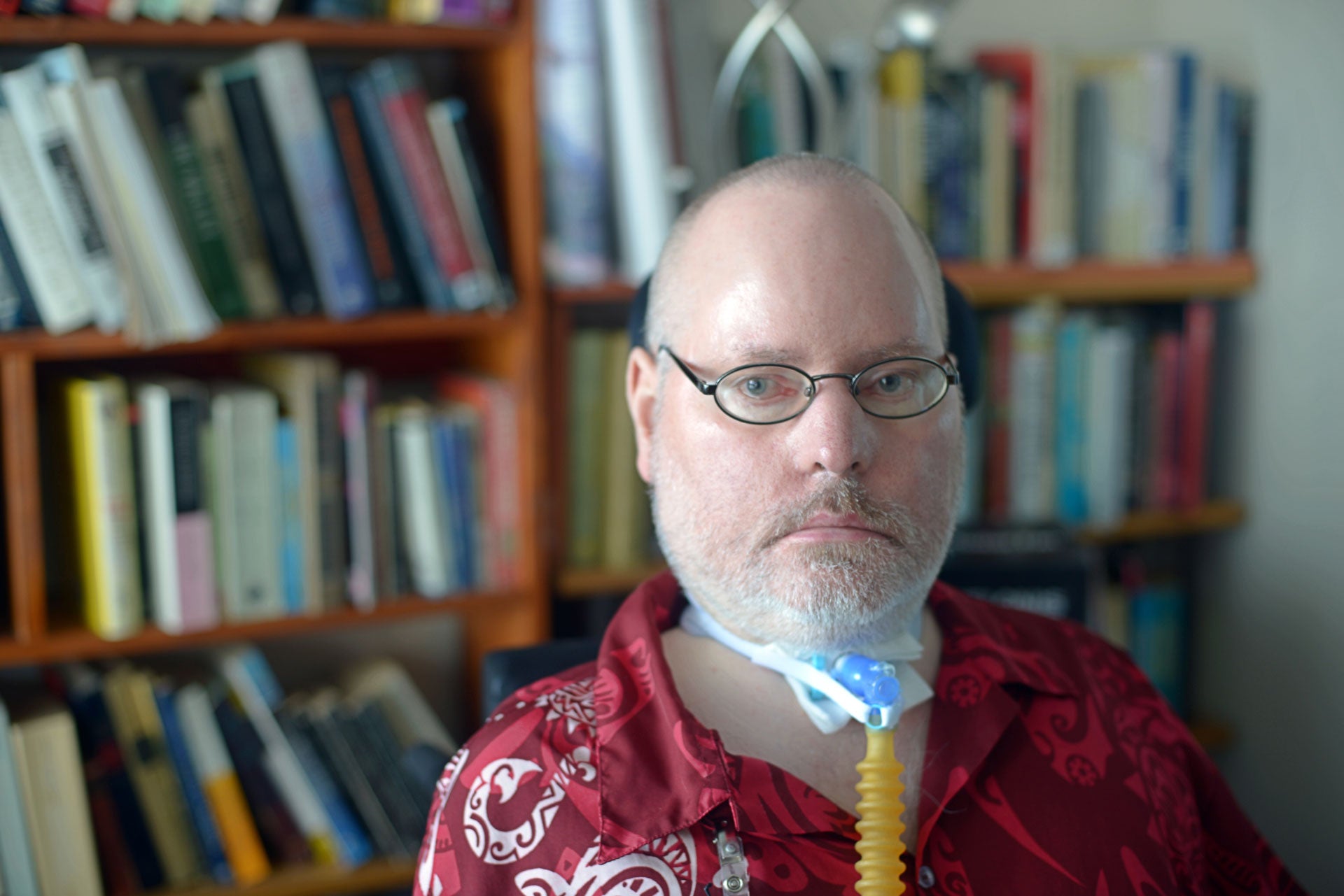 Paul Caune, executive director of the non-profit Civil Rights Now in Vancouver is seen in his power wheelchair in his apartment.