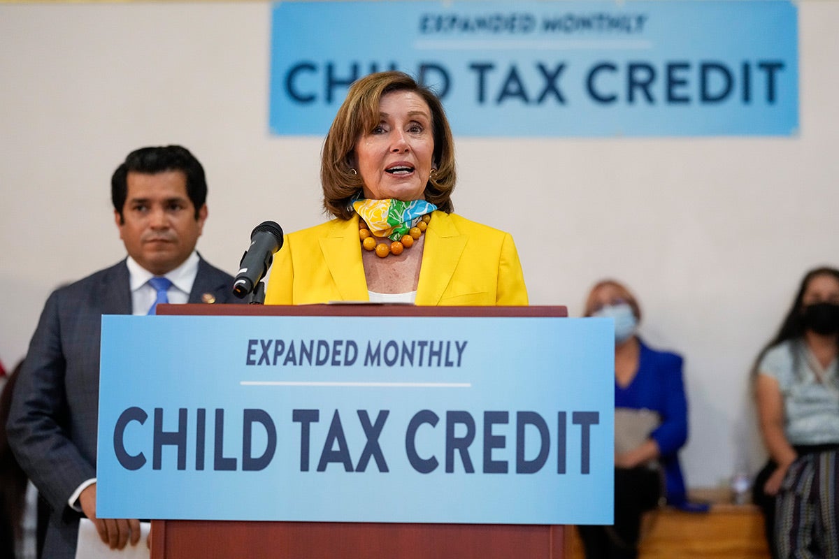 Speaker of the House Nancy Pelosi, center, and US Congressman Jimmy Gomez, hold a press conference about the new Child Tax Credit, in Los Angeles, July 15, 2021. 