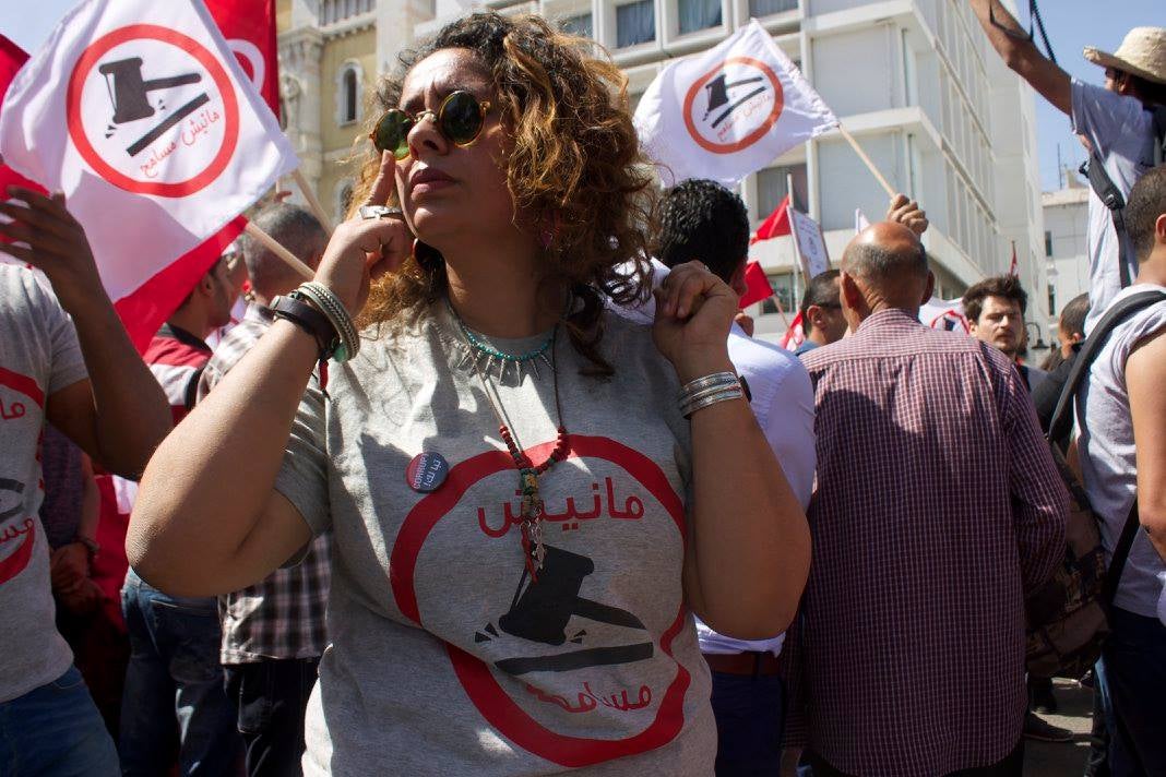 A woman in sunglasses at a protest