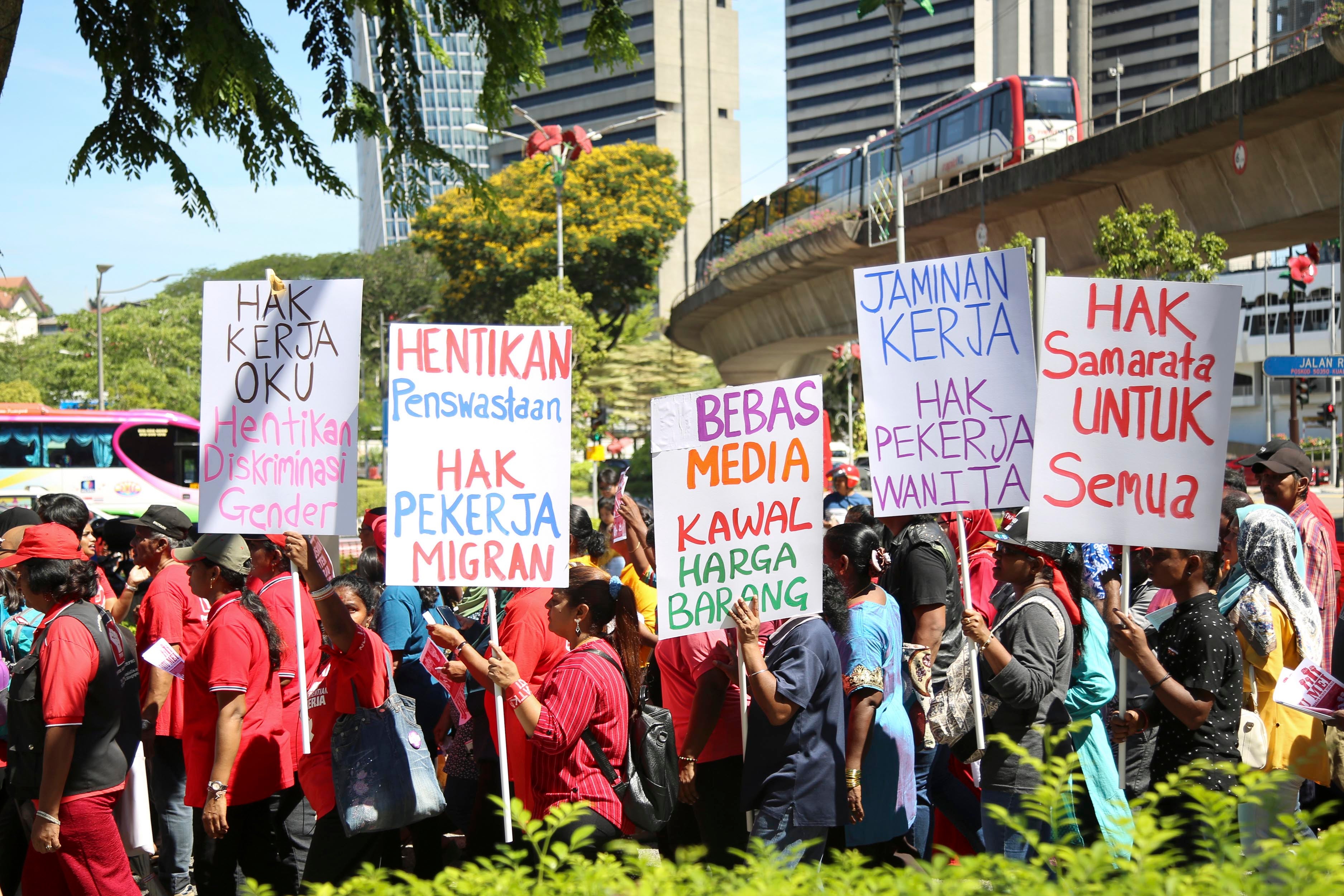 A group holding protest signs