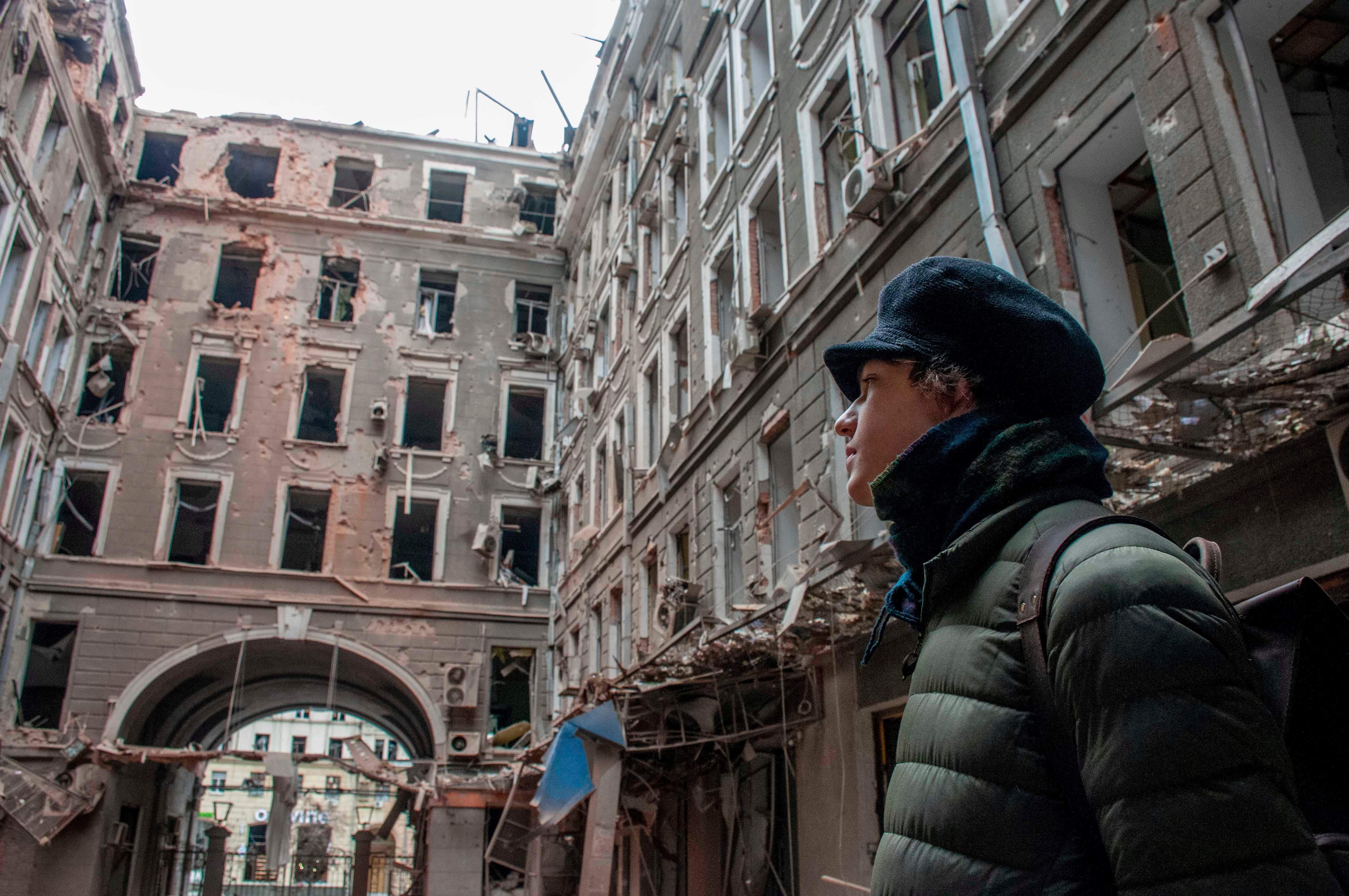 A local resident looks at his house destroyed in a Russian air raid in Kharkiv, Ukraine, March 3, 2022.