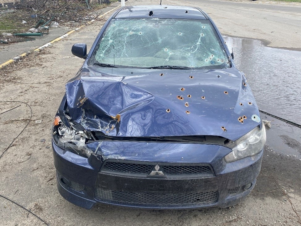 Russian forces in Hostomel opened fire on Oleksandr Maksymenko’s car while he was trying to evacuate on February 28, 2022, with his wife, son, and neighbor’s father. His son and neighbor’s father died.