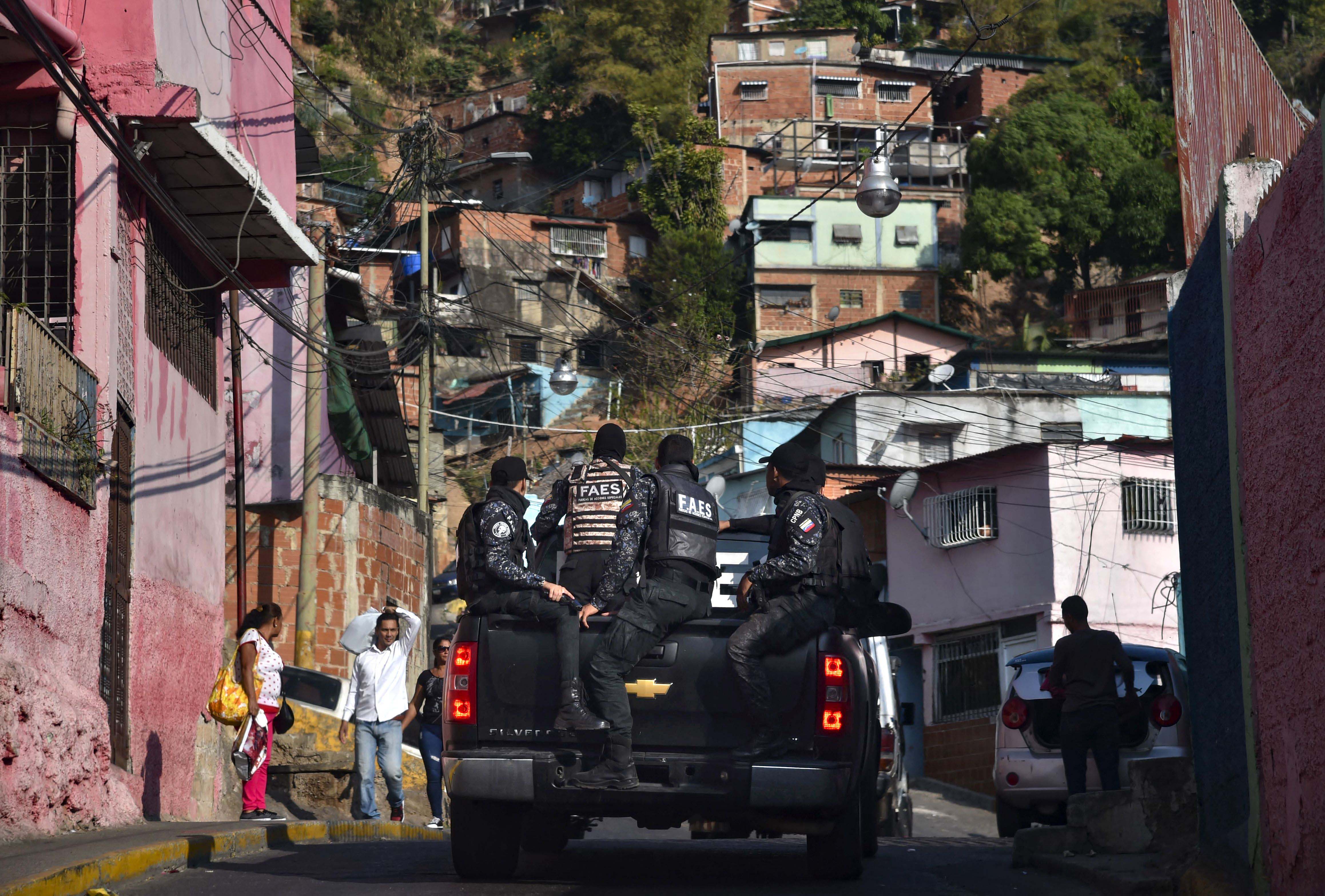 Members of Venezuela's Special Action Forces (FAES) carry out a security operation in Caracas, on April 1, 2019. 