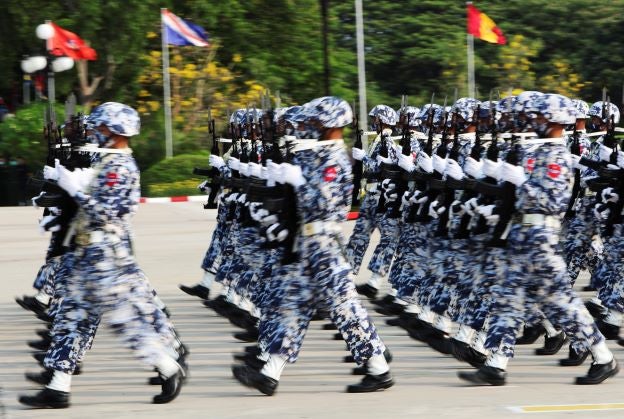 Myanmar military personnel march during a parade