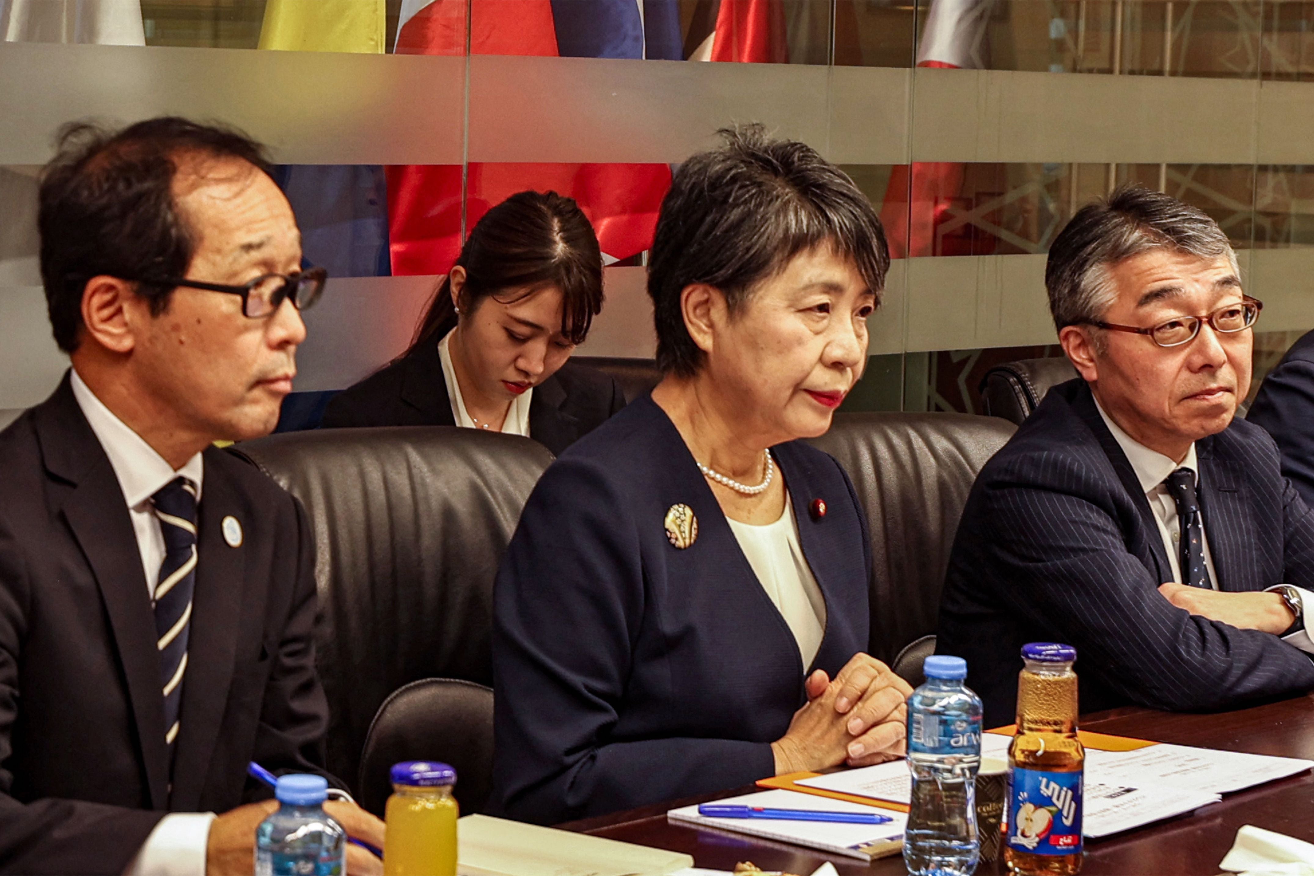 Japan's Foreign Minister Yoko Kamikawa (C) and her delegation met with both the Israeli Foreign Minister in Tel Aviv and later the Palestinian Foreign Minister in the occupied West Bank on November 3, 2023. 