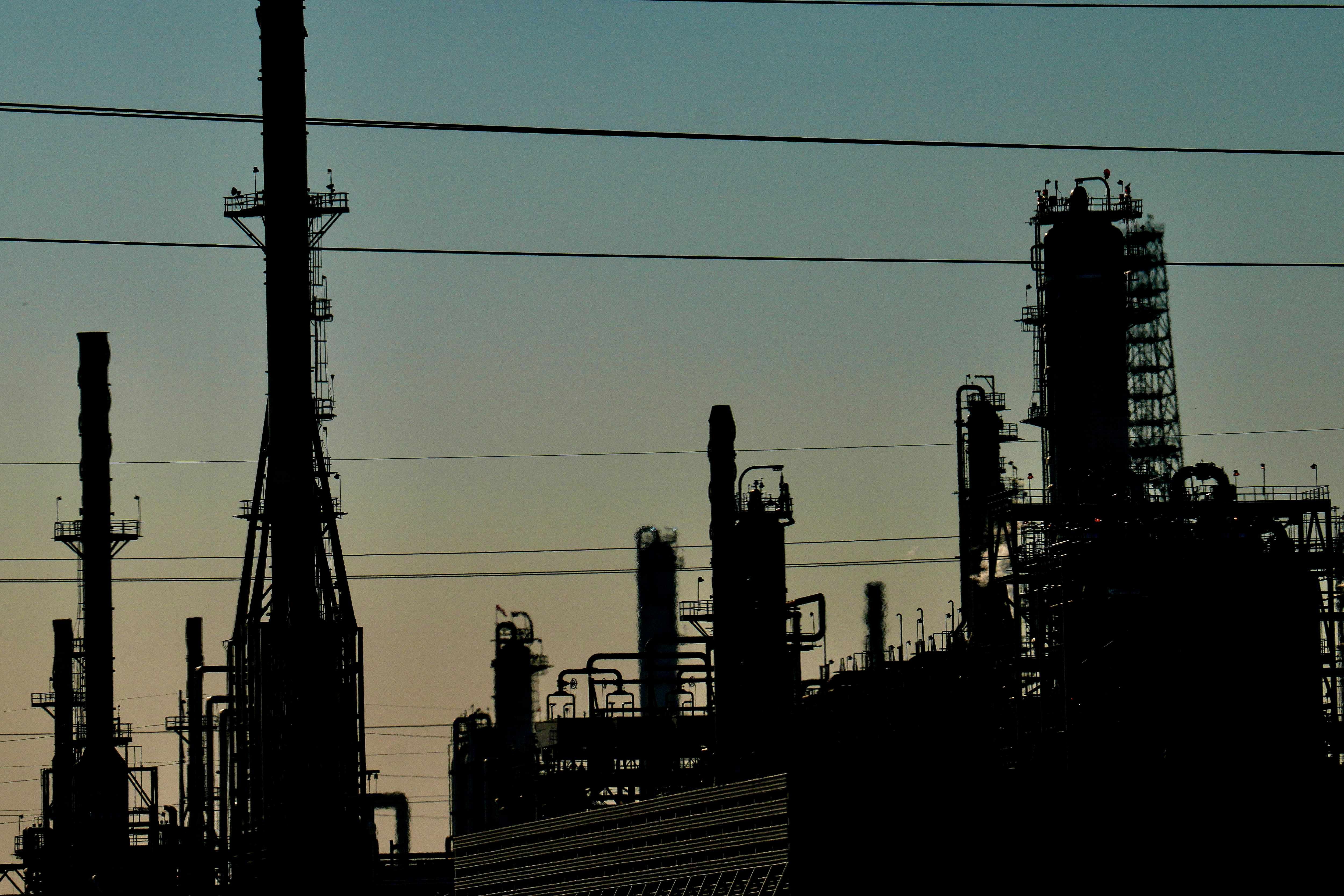 Silhouetted industrial plant