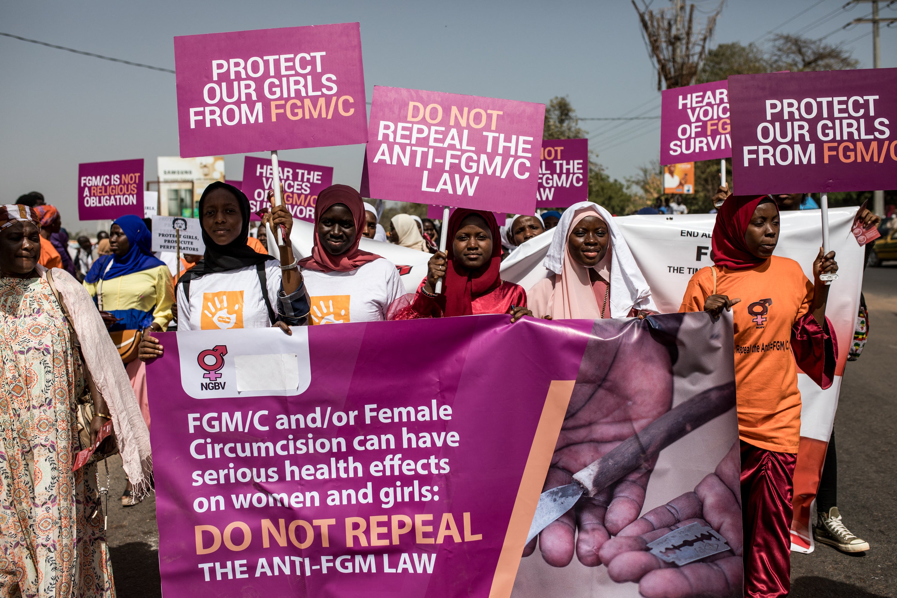 Protesters against female genital mutilation (FGM) demonstrate outside the National Assembly in Banjul, Gambia, on March 18, 2024. 