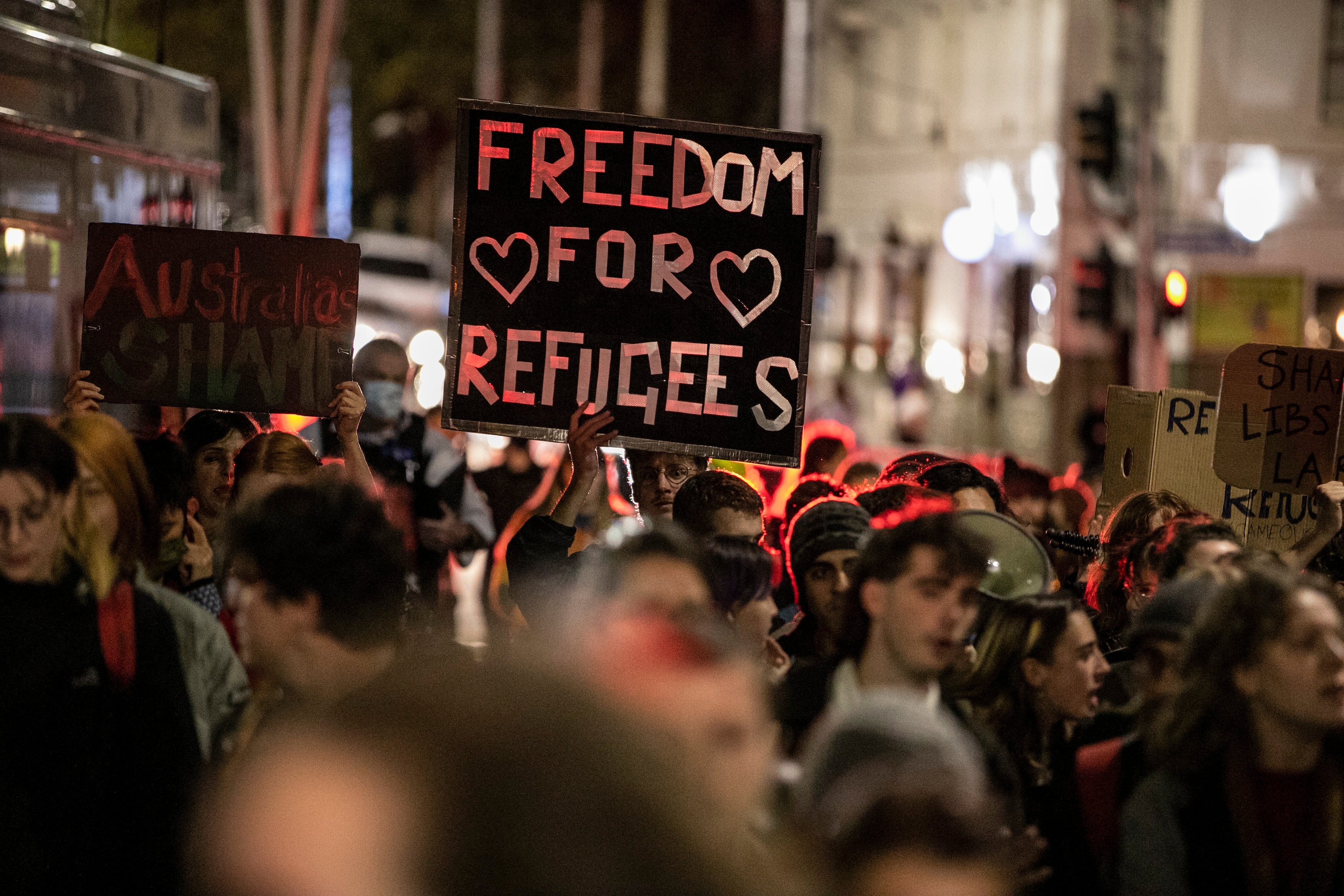 Demonstrators march on behalf of refugees and asylum seekers in Melbourne, Australia, April 19, 2021.