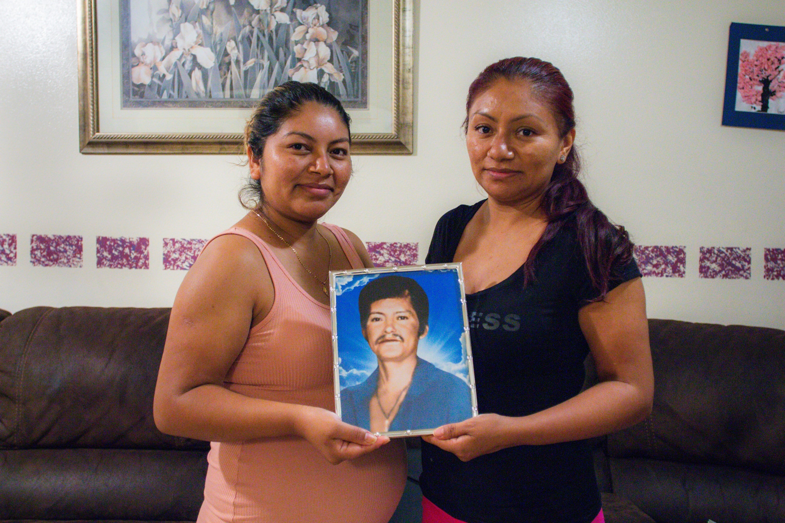 Bernal siblings sharing a picture of their father Gualberto Bernal, Los Angeles, California, 2021. 