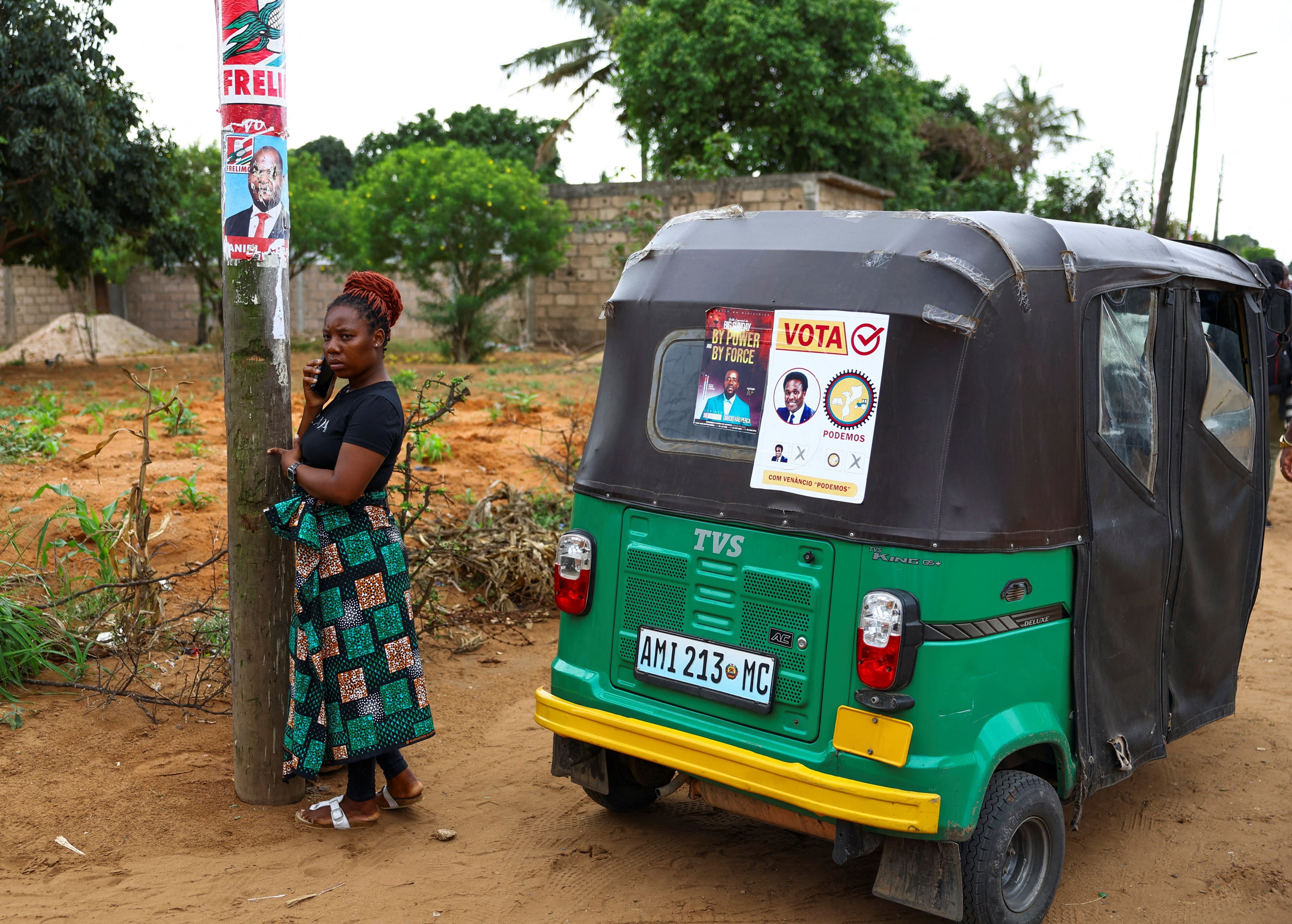 A woman speaks on a mobile phone.
