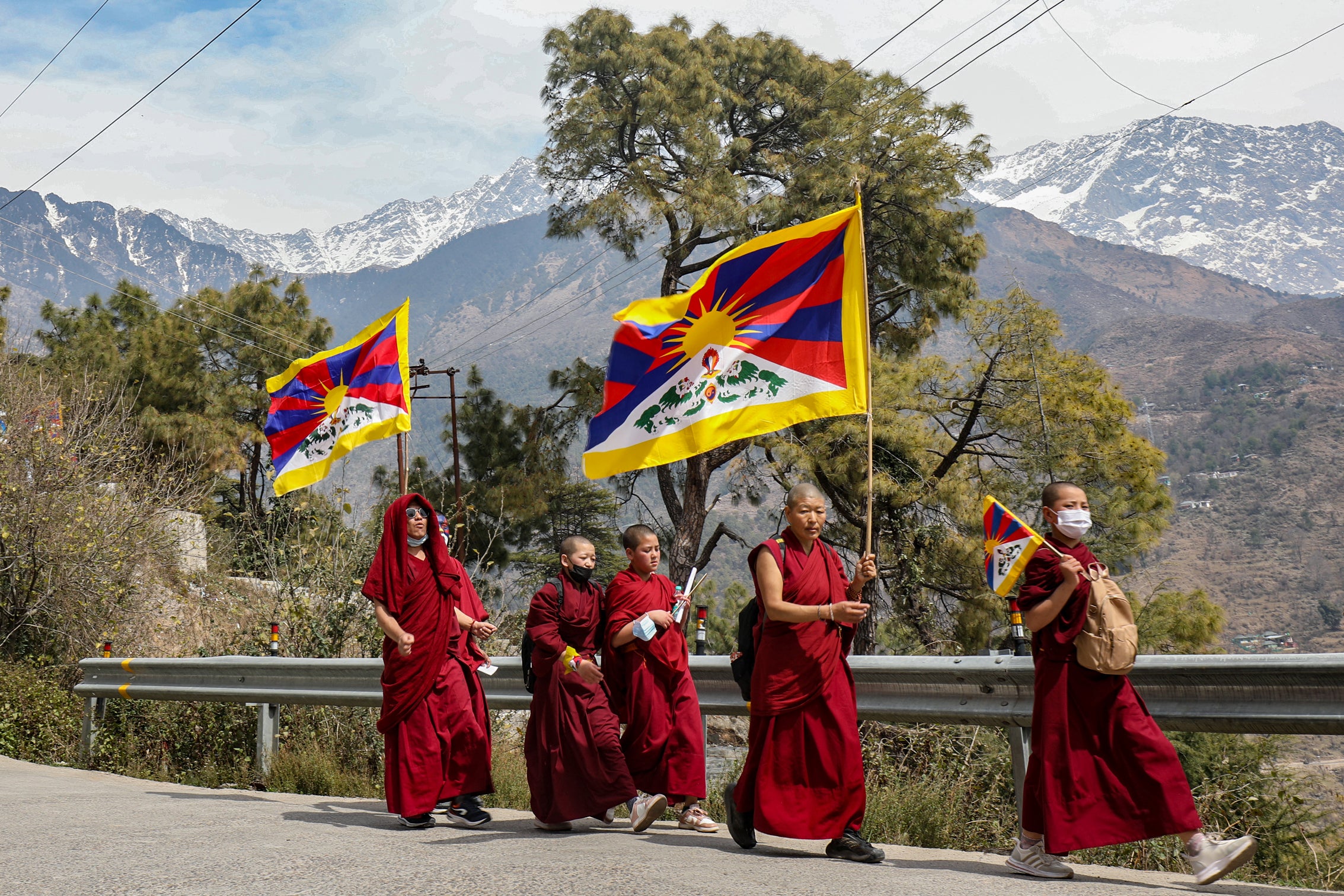 Tibetan monks in exile in India take part in a peace march commemorating the 1959 Tibetan uprising against Chinese rule, near Dharamsala, March 10, 2024.