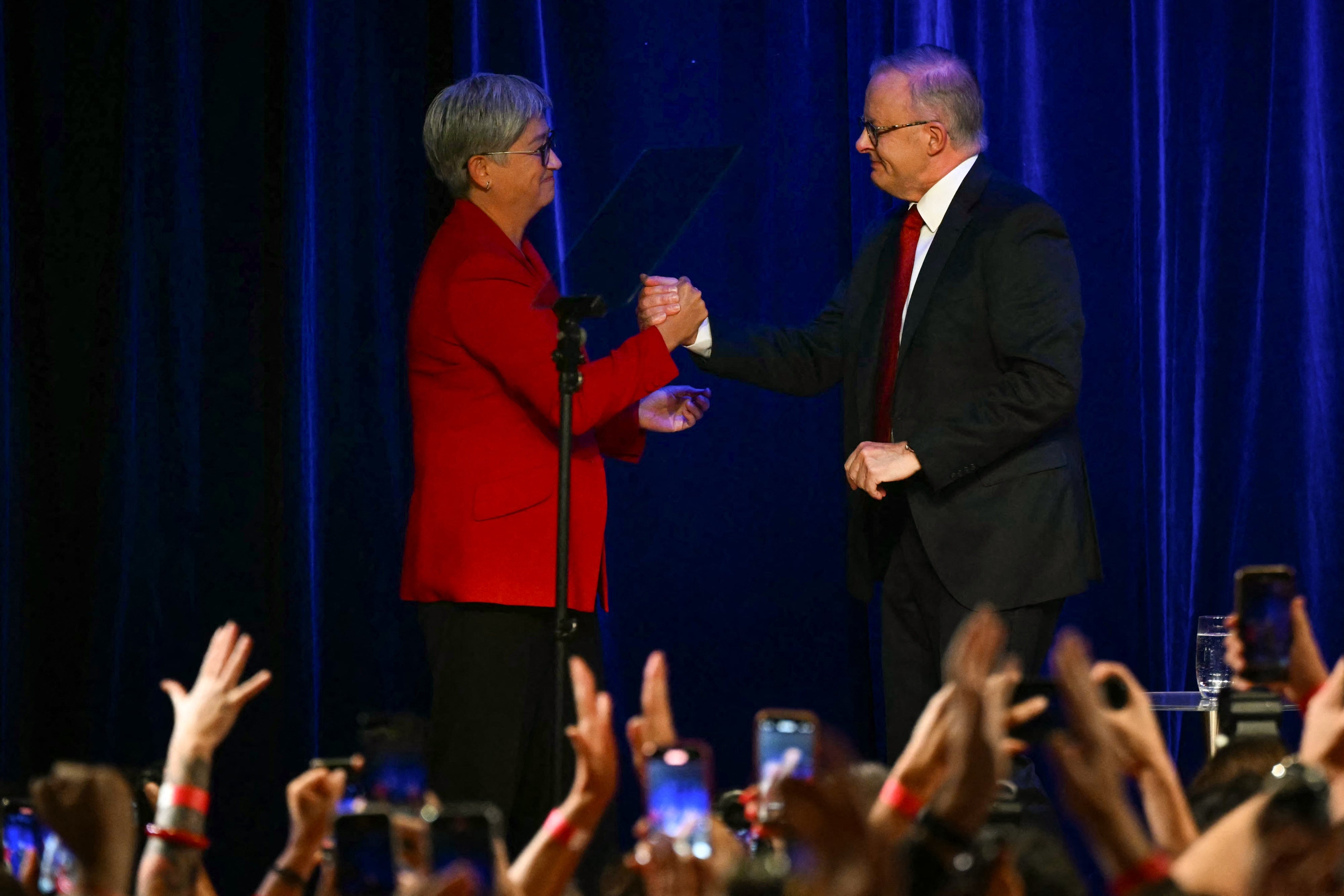 Australia's Foreign Minister Penny Wong (L) with Australia's Prime Minister Anthony Albanese after he won the general election in Sydney, May 3, 2025.