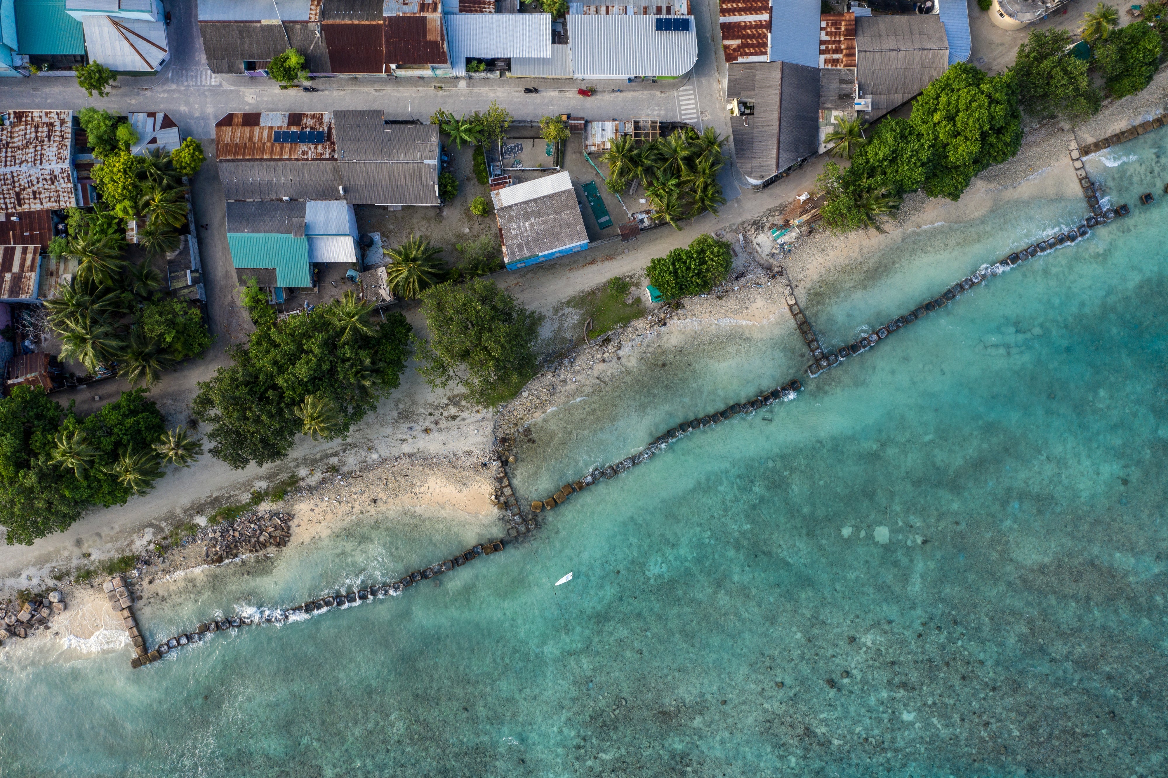 Concrete blocks are placed along the shoreline to try and prevent further coastal erosion in Mahibadhoo, Maldives, December 17, 2019.