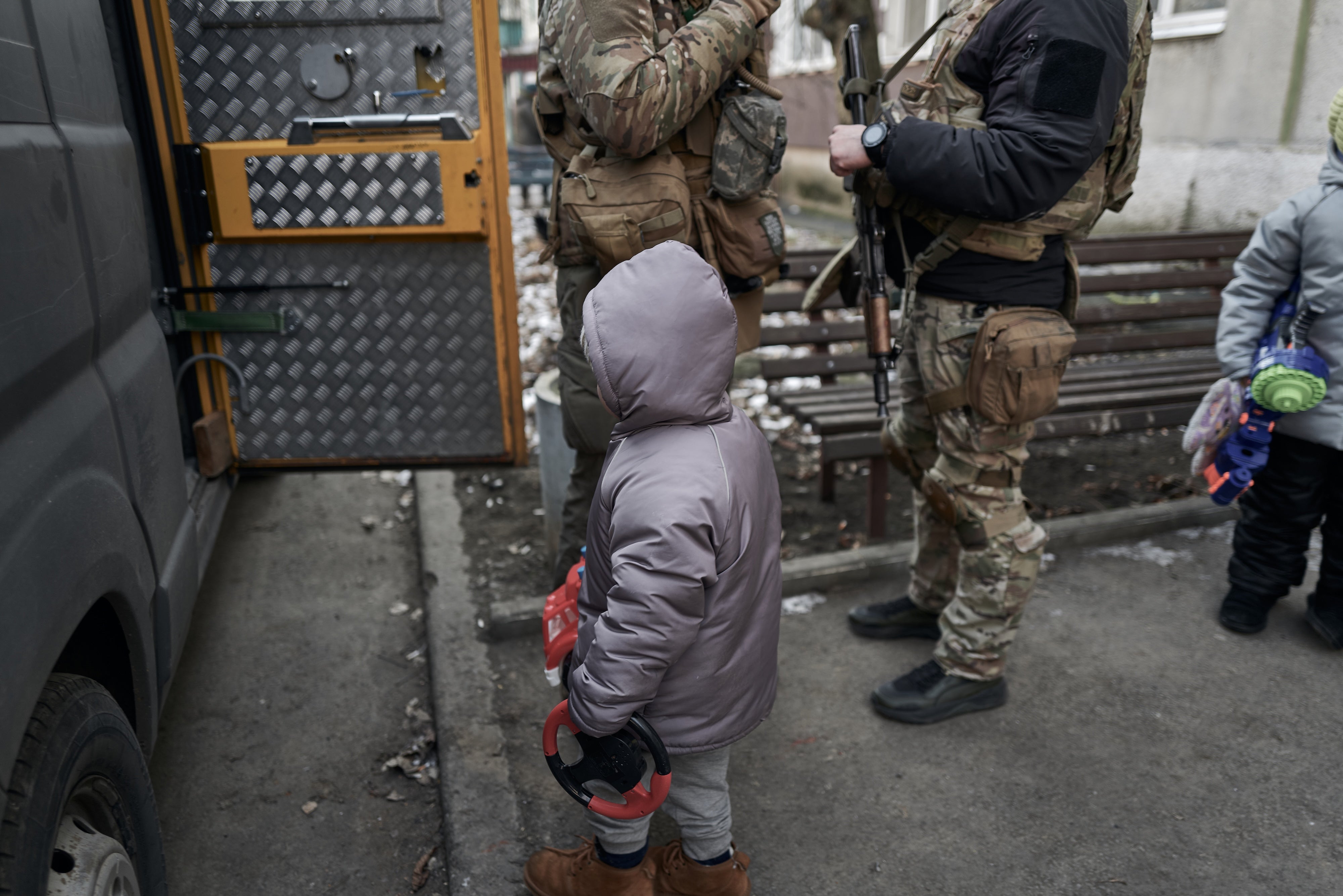 Civilians, including two young children, are evacuated from a shelling zone, Pokrovsk, Ukraine, February 14, 2025.