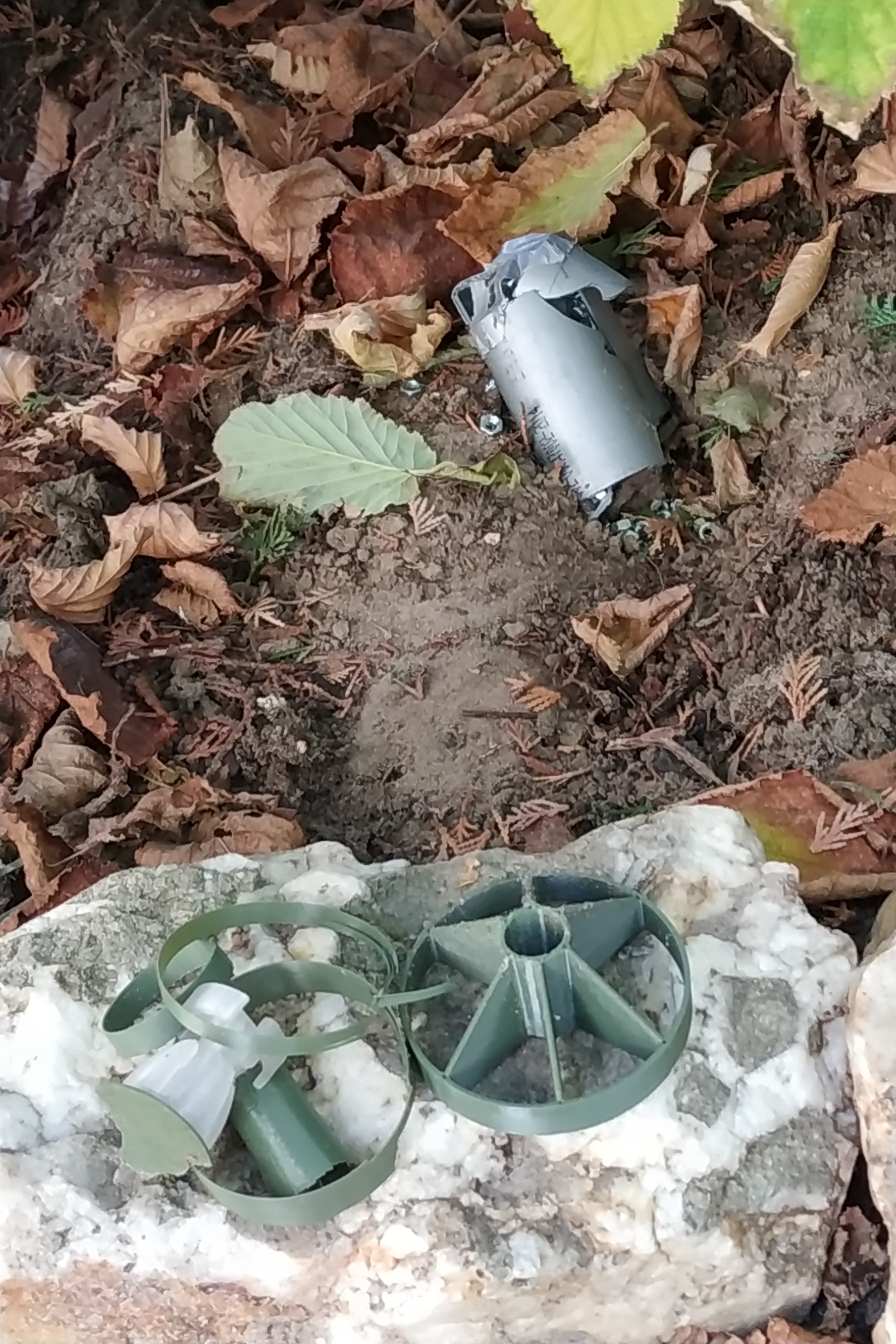 Remnants of a drone-dropped munition lying on the ground