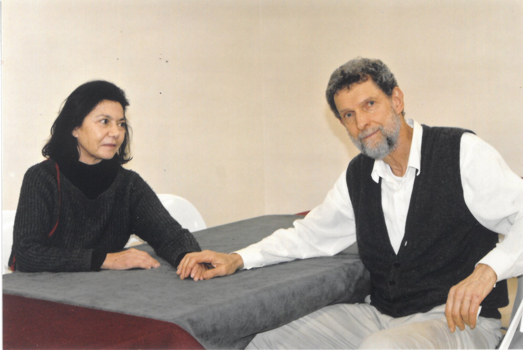Osman Kavala and his wife Ayşe Buğra photographed during her visit to him in Silivri prison, Istanbul, January 2025.