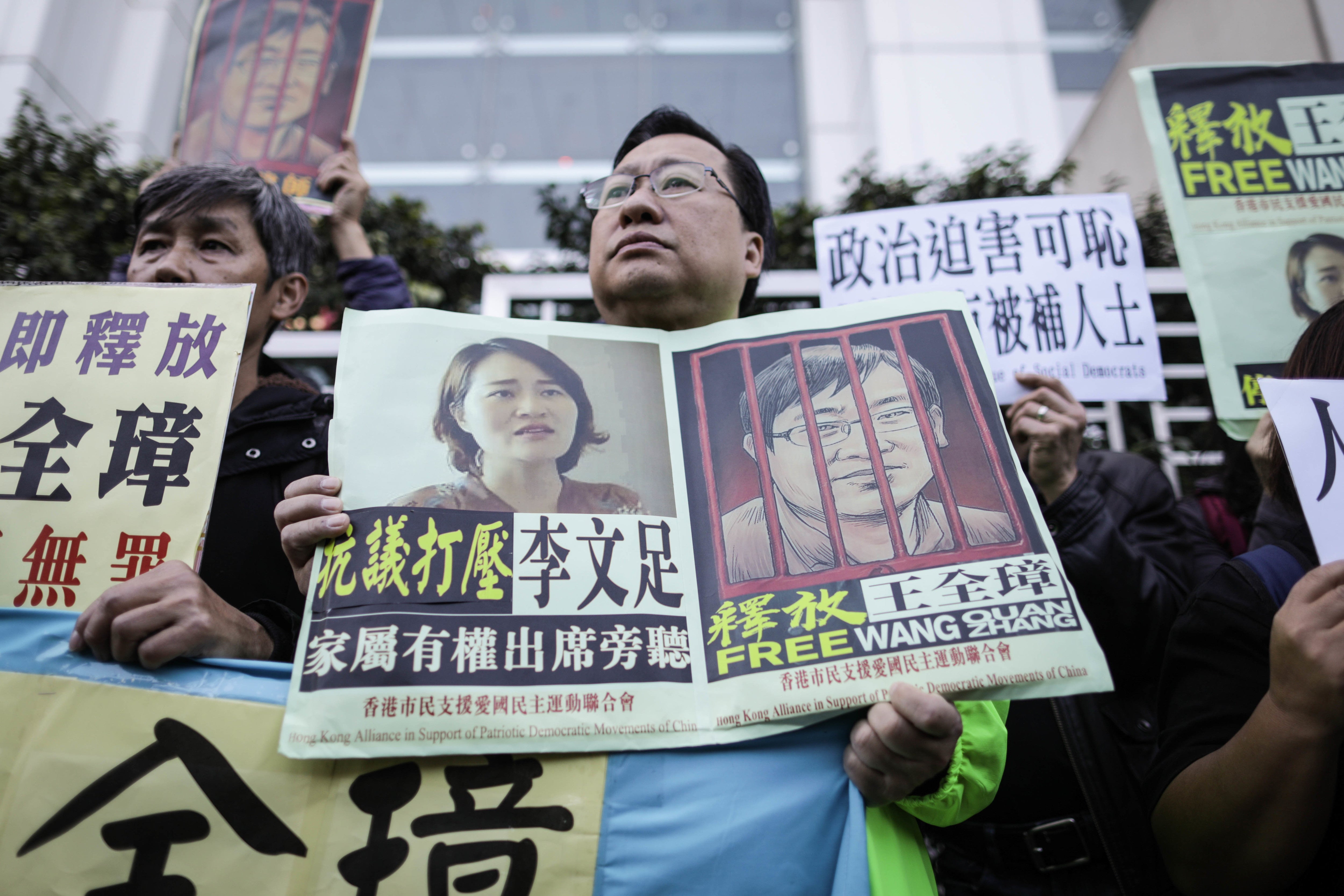 Protesters hold posters of imprisoned lawyer Wang Quanzhang during a demonstration at the China Liaison Office in Hong Kong against the crackdown on human rights lawyers in China, December 26, 2018. 