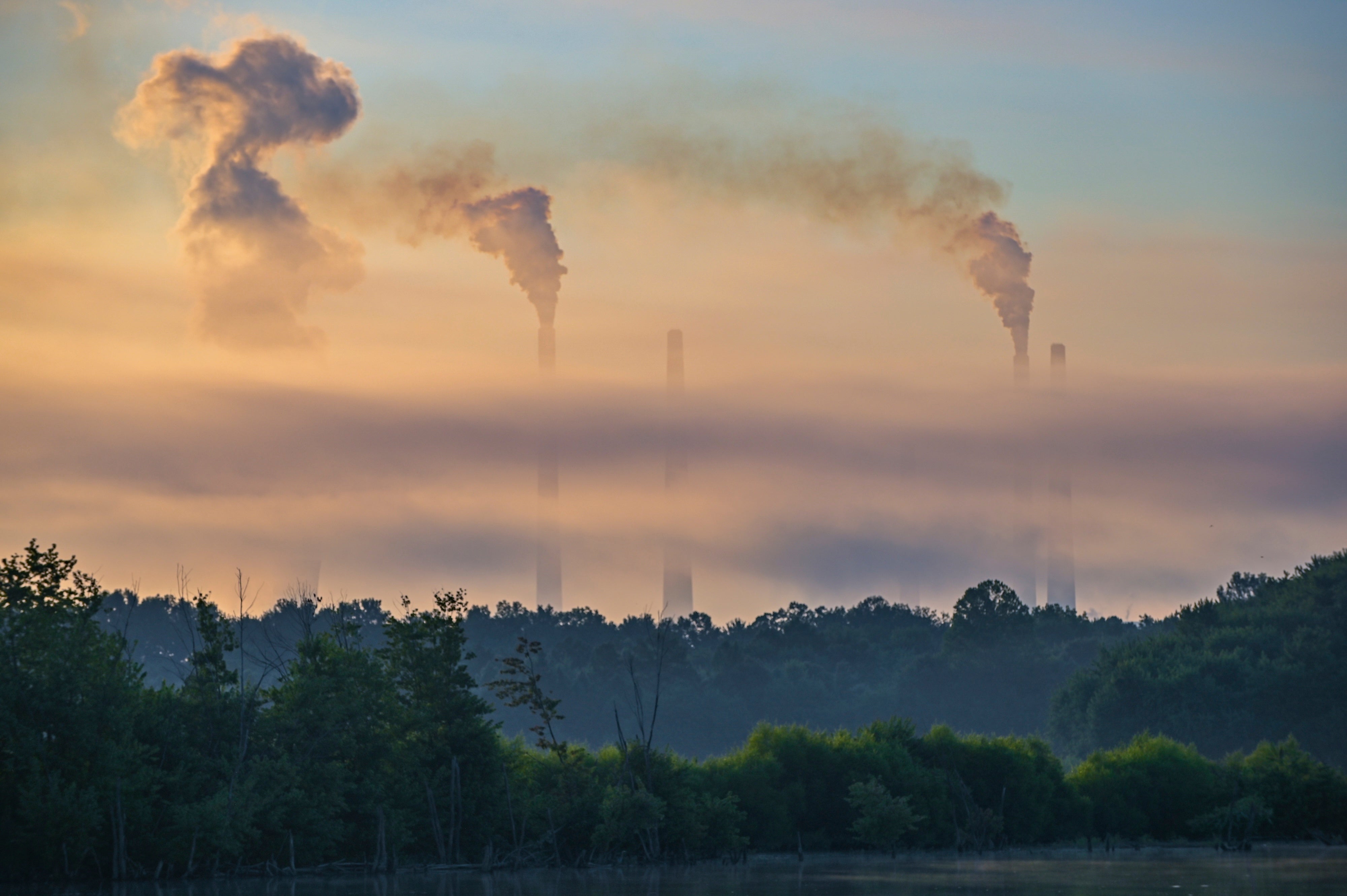 Pollution rises from the stacks of the Miami Fort Power Plant, which is situated along the Ohio River near Cincinnati, Ohio, July 11, 2025