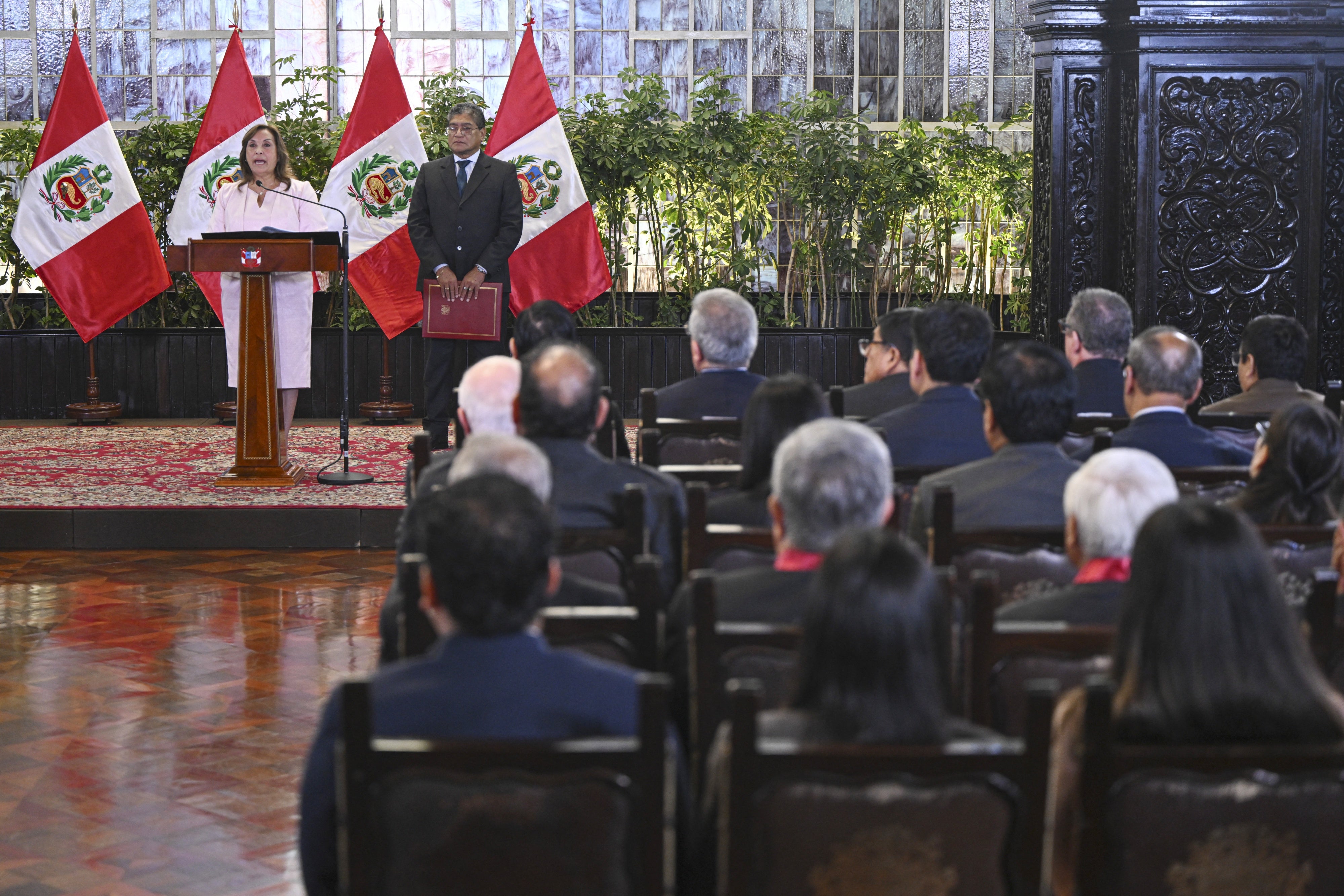 Peru's President Dina Boluarte delivers a speech during a ceremony enacting an amnesty law for military and police personnel prosecuted for human rights violations at the Government Palace in Lima on August 13, 2025. 