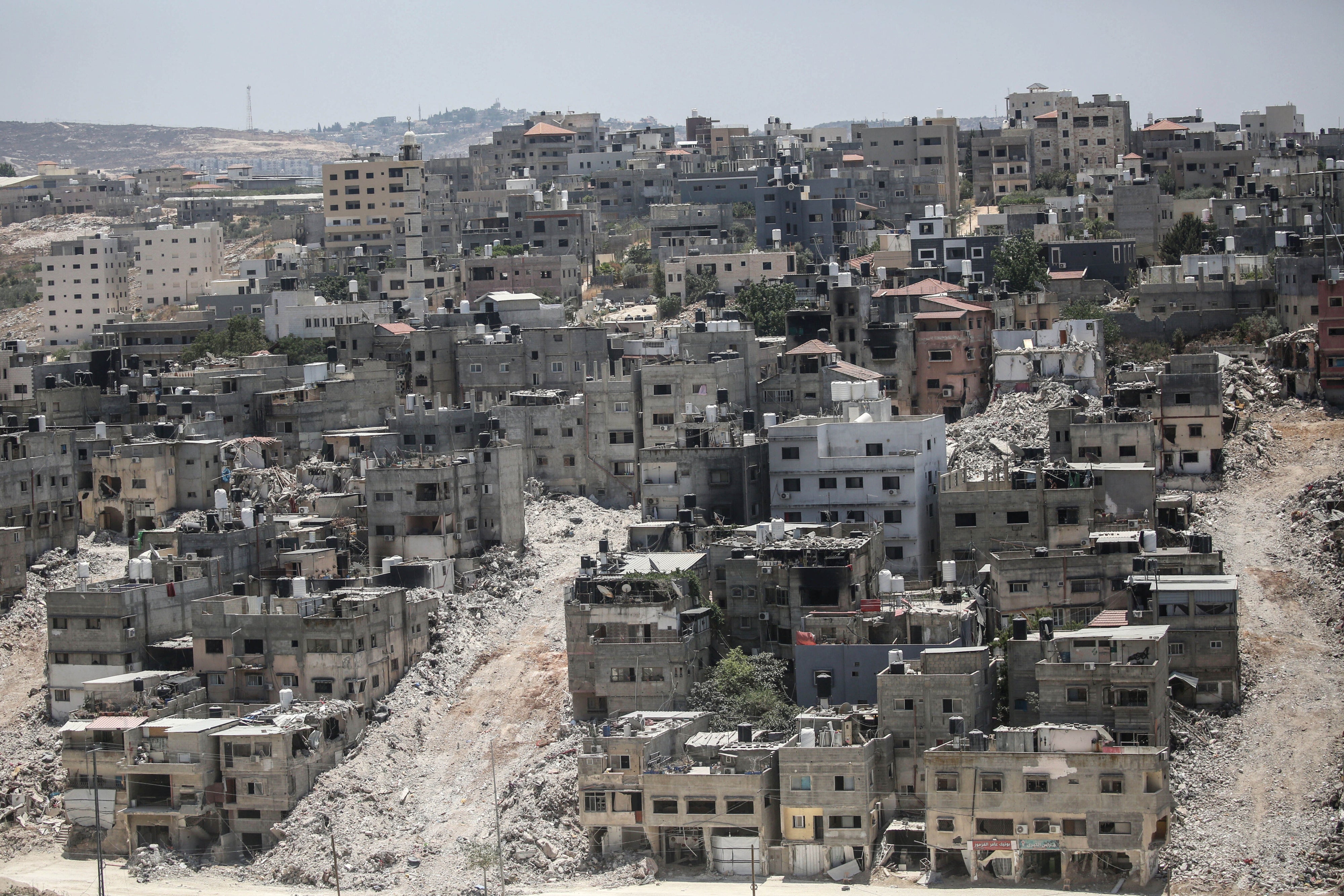 A view of damaged buildings in Nur Shams refugee camp