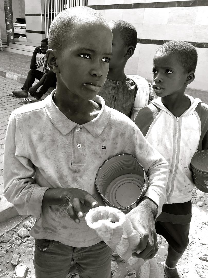 Talibés begging outside a pharmacy in Dakar, Senegal, May 7, 2017. 
