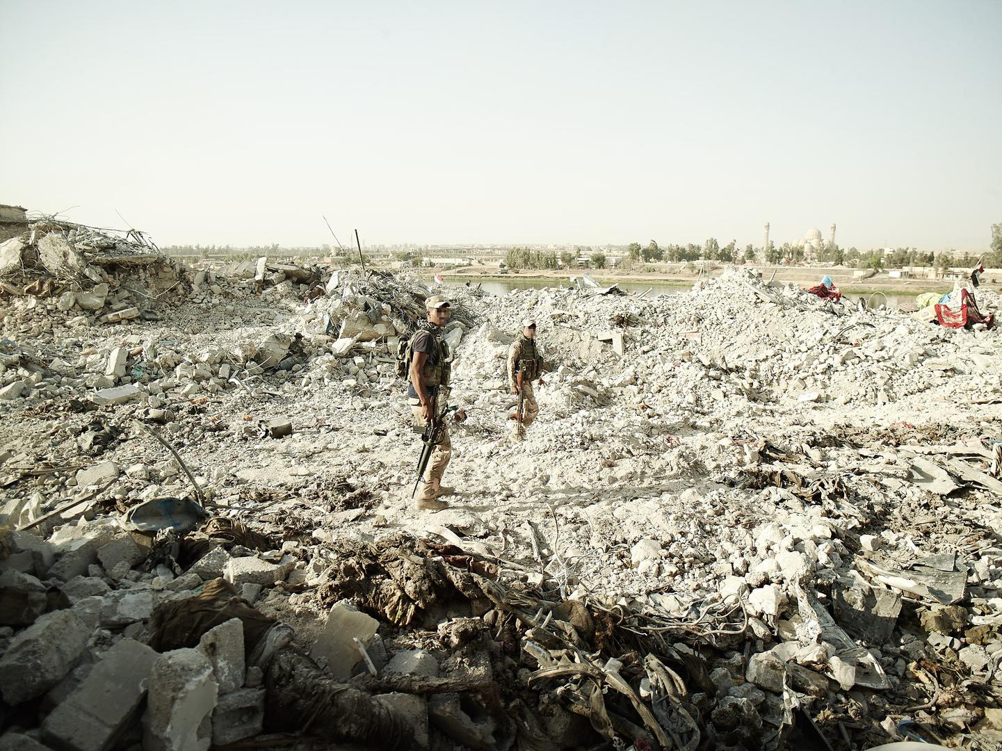 Several bodies of alleged ISIS fighters in the foreground, near the Tigris River in Mosul’s Old City executed by Iraqi soldiers identified as from the army’s 16th Division. 
