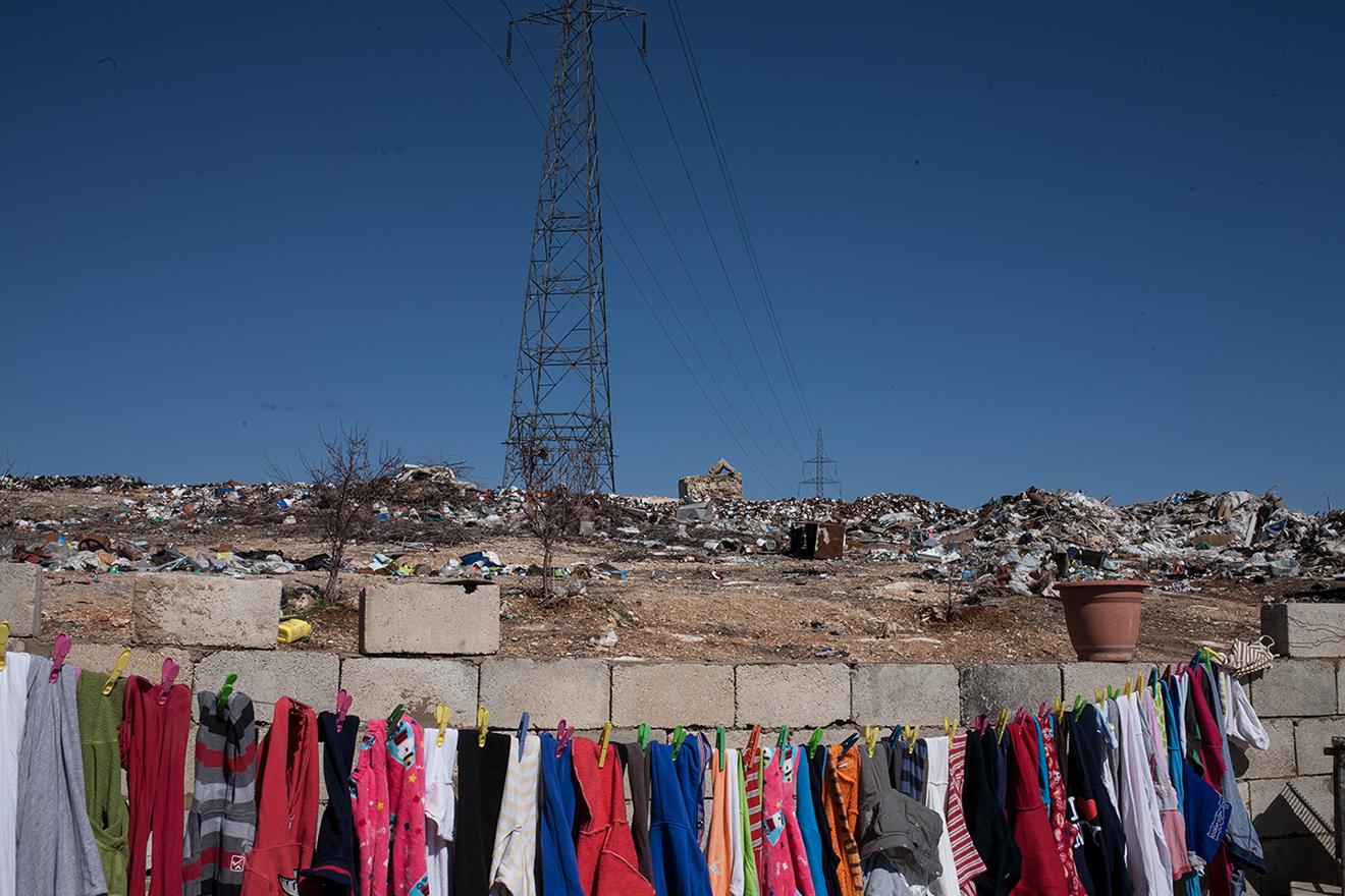 An open dump in Baalbek just meters from this family’s home. 