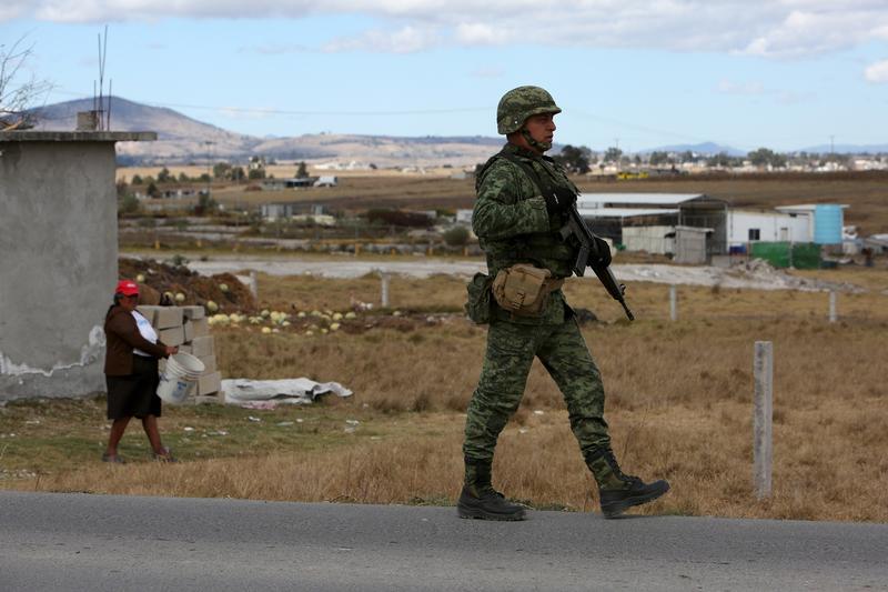A soldier walking in Almoloya de Juarez, on the outskirts of Mexico City, January 10, 2016