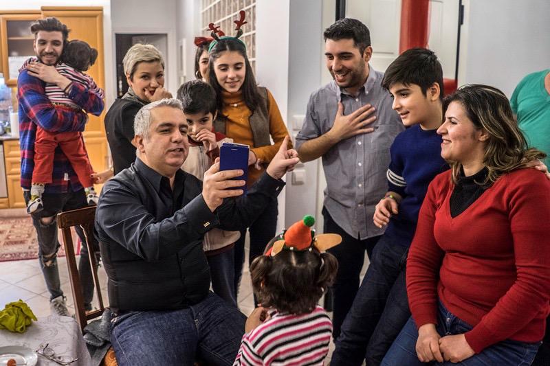 On Boxing Day in the Osanas’ house in Greece, Dominique called Falak’s husband, Mohammed, on Skype and introduced his family. © 2017 Anna Pantelia