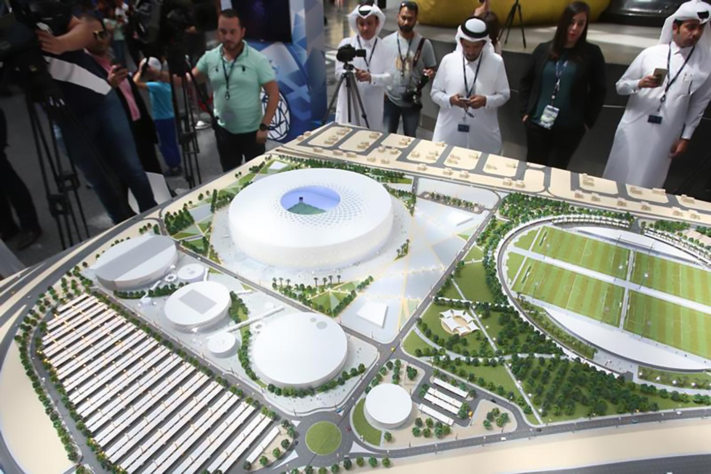 People look at a model of Al Thumama stadium during an unveiling ceremony at Hamad International Airport in Doha, Qatar, August 24, 2017. © 2017 REUTERS/Naseem Zeitoon