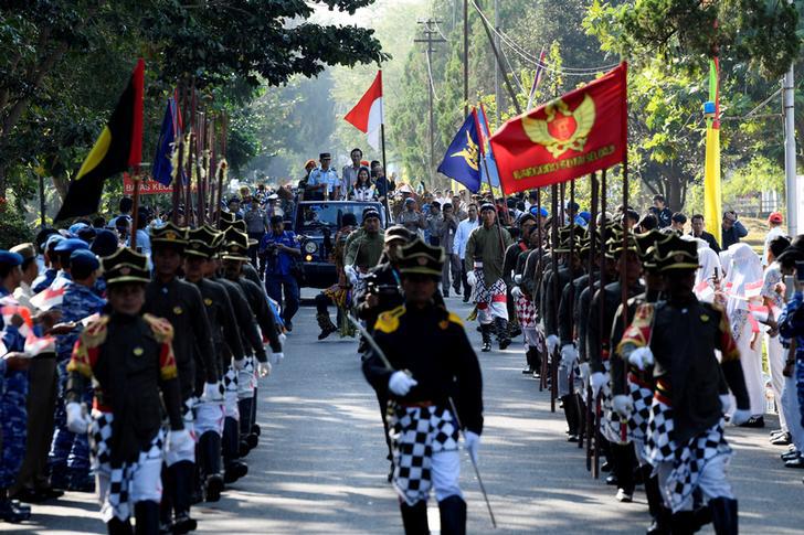 A parade marks the arrival of the Asian Games torch from India ahead of the 18th Asian Games, in Sleman, Yogyakarta, Indonesia July 17, 2018. 