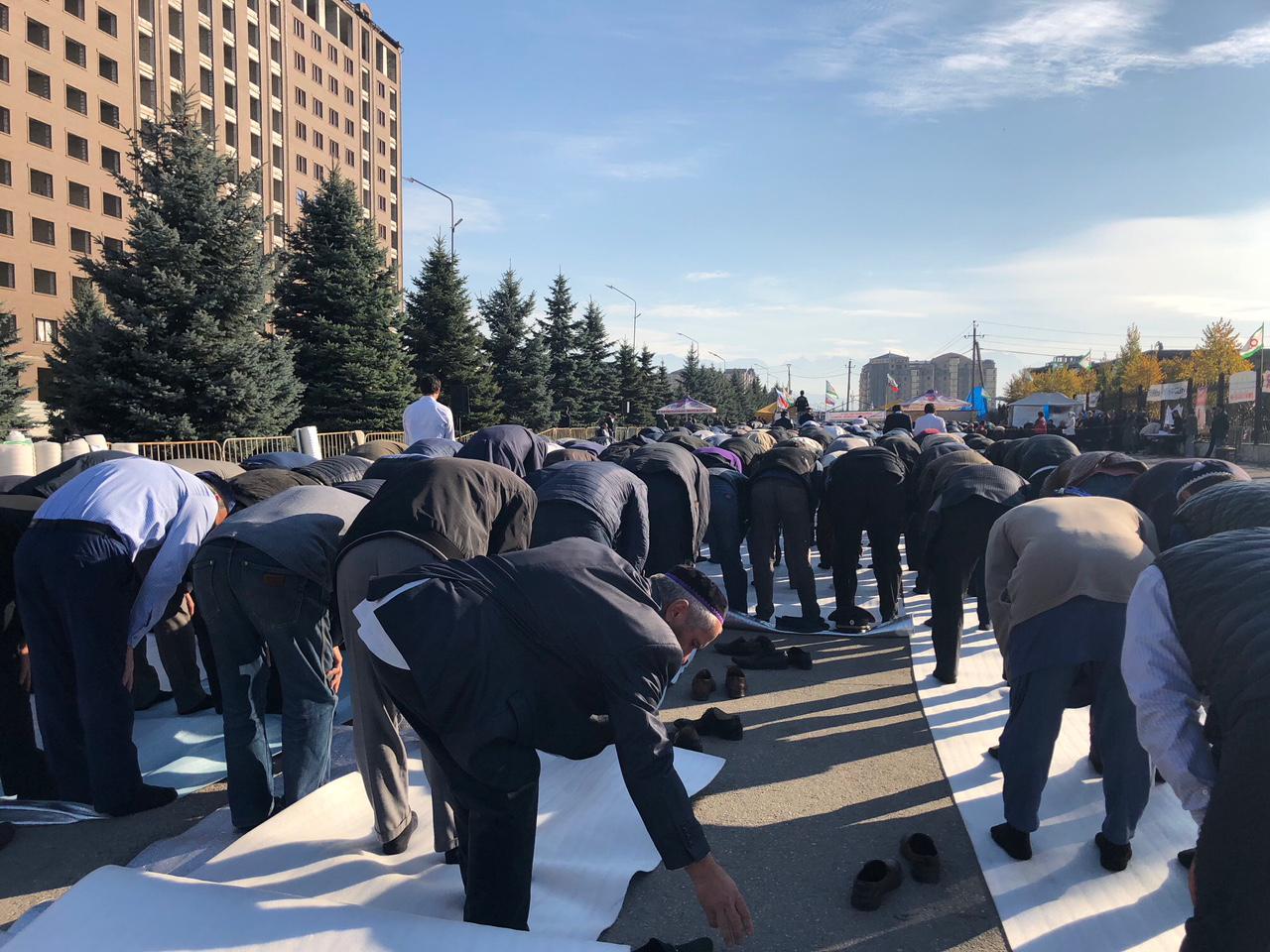 Men praying at the protest rally in Magas, Ingushetia 