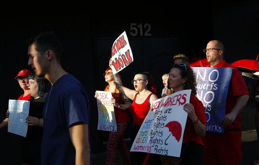 People march in support of sex workers, Sunday, June 2, 2019, in Las Vegas. 