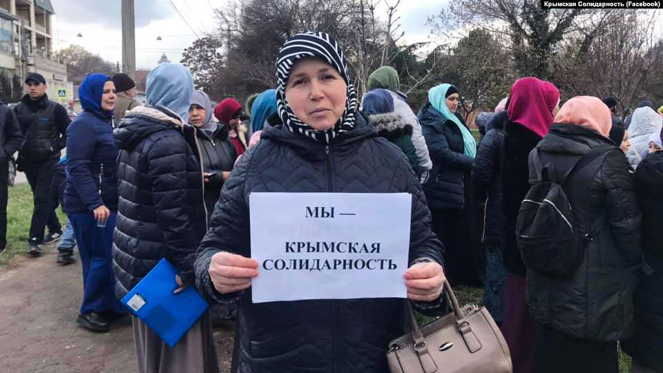 Activists of Crimean Solidarity gather by a court building in Simpheropol, Crimea.