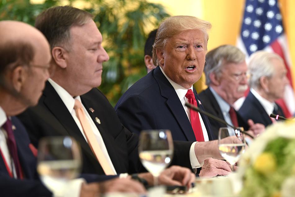 President Donald Trump, Commerce Secretary Wilbur Ross, Secretary of State Mike Pompeo, National security adviser John Bolton, and White House trade adviser Peter Navarro, speak with Saudi Arabia's Crown Prince Mohammed bin Salman