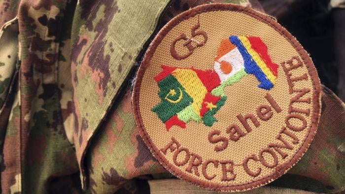 A soldier stands guard in front of the G5-Sahel Counter Terrorism Force headquarters in Mali, May, 30, 2018. 