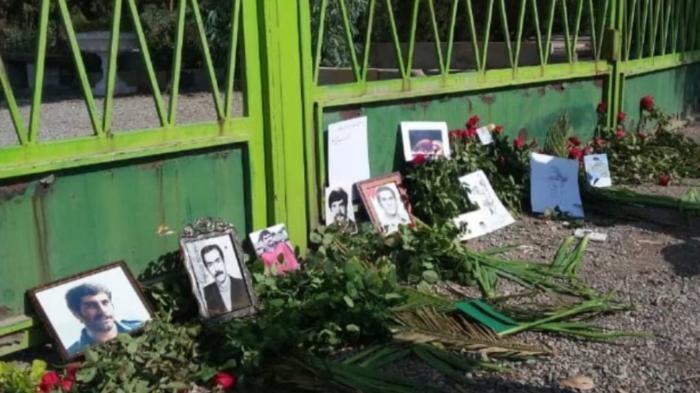 Photos of victims at a memorial commemorating those killed during the mass executions in the 1980s, Khavaran cemetery in Tehran, Iran, 2020.