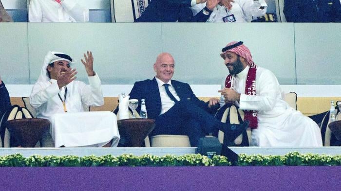 Emir and President of Qatar Sheikh Tamim bin Hamad Al Thani, FIFA President Gianni Infantino, and Saudi Arabia's Crown Prince Mohammed bin Salman al-Saud at the 2022 Qatar World Cup, on November 20, 2022, in Al Bayt Stadium in Doha, Qatar.