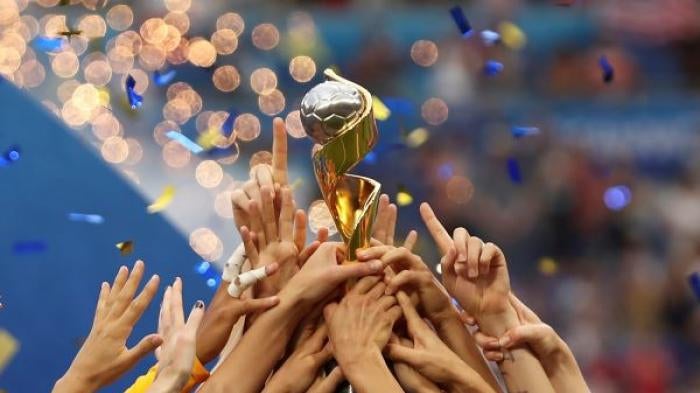 In this July 7, 2019, file photo, the United States players hold the trophy as they celebrate winning the Women’s World Cup final soccer match against The Netherlands at the Stade de Lyon in Decines, outside Lyon, France. The 2023 Women’s World Cup will be spread across nine cities in Australia and New Zealand. (AP Photo/Francisco Seco, File)